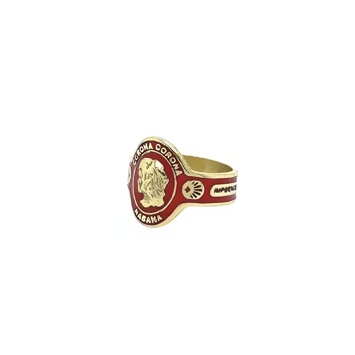 An 18 karat yellow gold and enamel ring, Cartier.  Designed as a cigar band highlighted with red enamel centering the head of a girl in profile and labeled Corona, Havana, Importado.  Size approximately 7.  Gross weight approximately 7.30 grams. 
