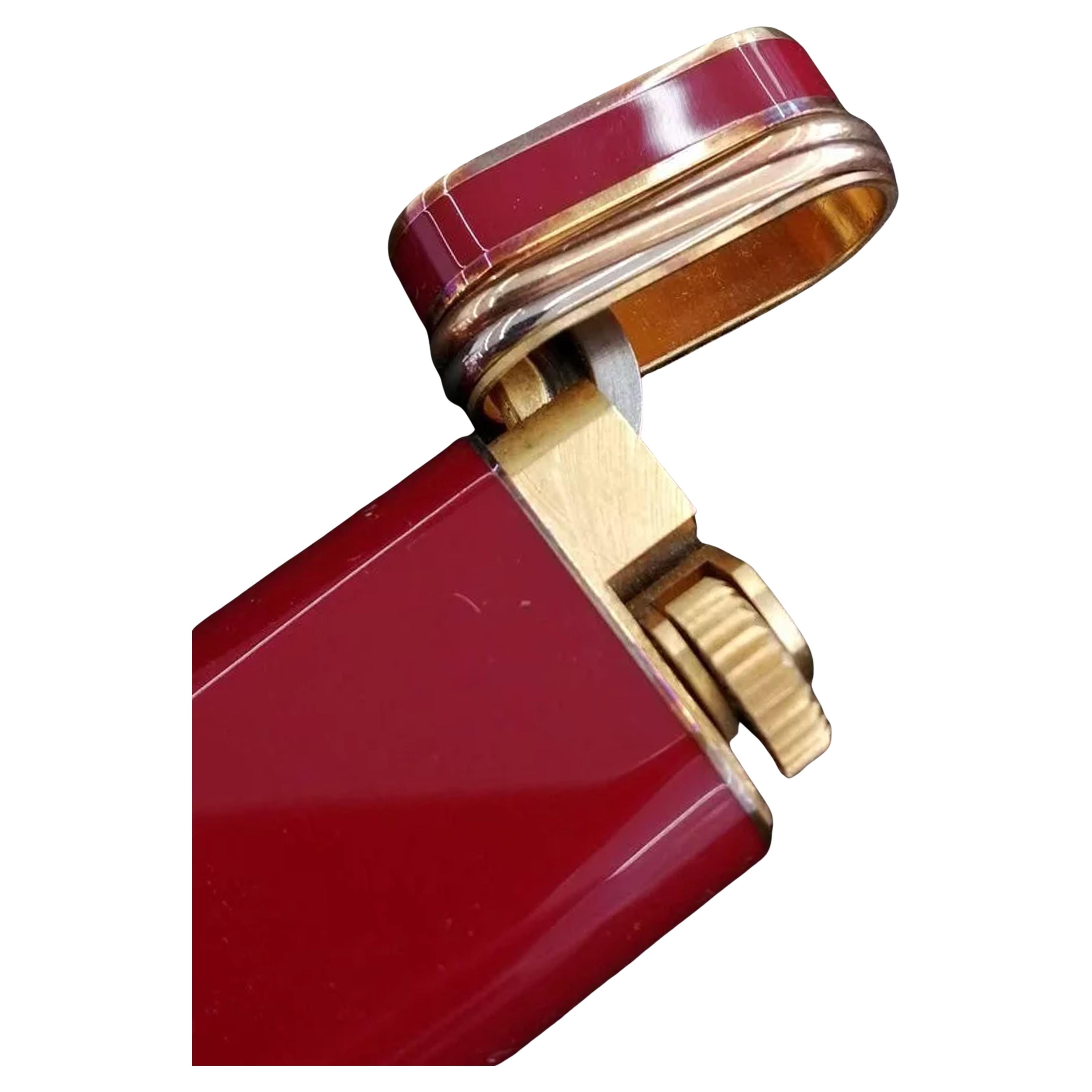 Elegant Must De Cartier Red Lacquer 3 Banded 18ct Gold Plated Trinity Cigarette Lighter With Box & Guarantee

Lighter has been serviced

Marked Cartier Paris To Lighter Base 

Complete With Original Box, Instructions 

