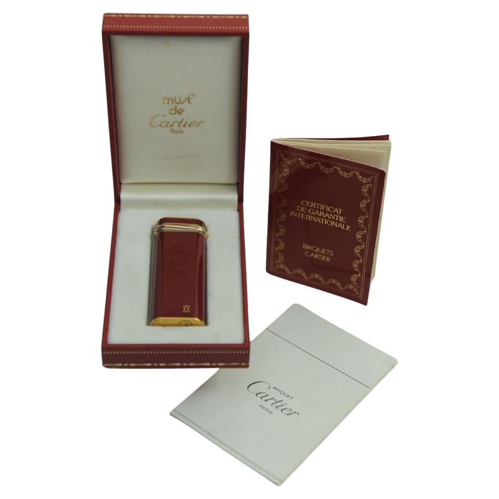Cartier Red Lacquer 18ct Gold Plated Trinity Cigarette Lighter Box 
Guarantee in vendita