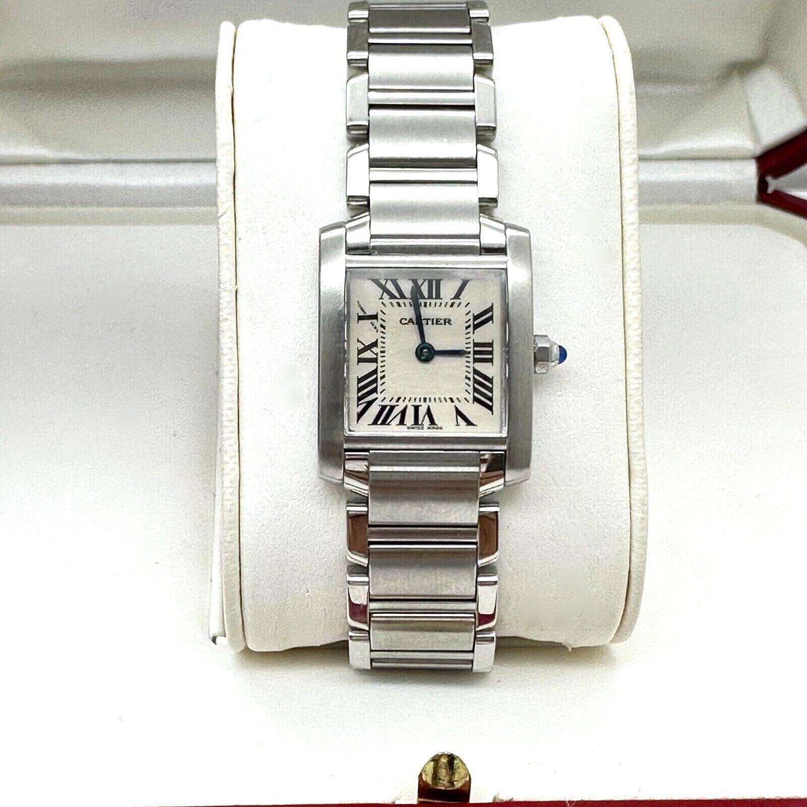 Style Number: 2384

Year: 2001

Model: Tank Francaise

Case Material: Stainless Steel

Band: Stainless Steel

Bezel:  Stainless Steel

Face: Sapphire Crystal 

Case Size: 20mm

Includes: 

-Cartier Box & Paper

-Certified Appraisal 

-1 Year