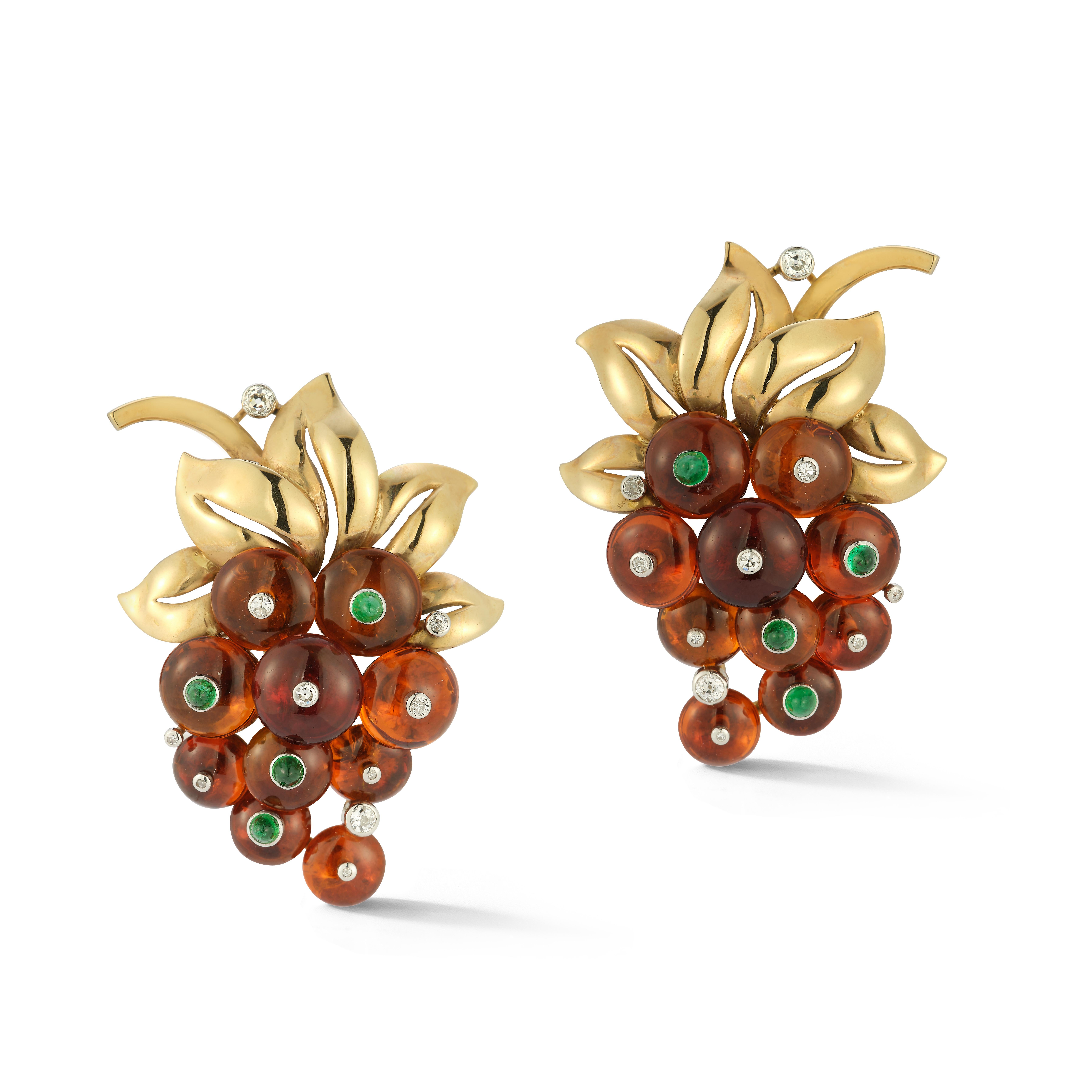 Cartier Retro Citrine Grape Cluster Earrings

A pair of yellow gold earrings set with 20 cabochon citrines and set with by 8 cabochon emeralds and 20 round diamonds.

Signed Cartier London & numbered

Back Type: Clip-on

Measurements: 2