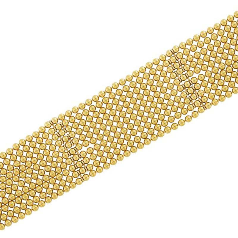 A Multi-strand Gold Bead 'Draperie' Bracelet by Cartier. Made in France, circa 1960.
The ten flexible gold bead strands terminating in three looped button clasps, signed Cartier, no. I82793, with French assay marks, approximately 29 dwts. Length 6