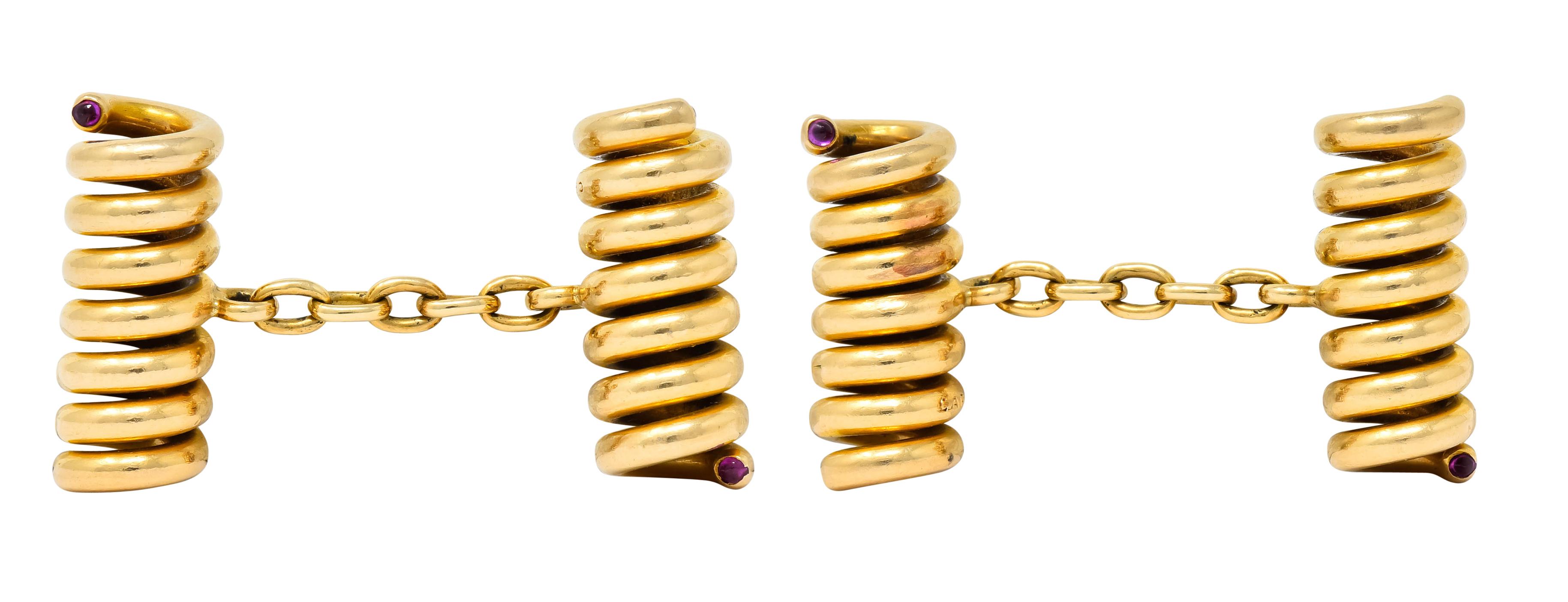 Link style cufflinks designed as spiraled corkscrews terminating as small ruby cabochon accents

Brightly polished

Fully signed Cartier

Tested as 18 karat gold

Circa: 1940s

Length: 1 1/4 inches

Corkscrew measures: 1/4 x 3/4 inch

Total weight: