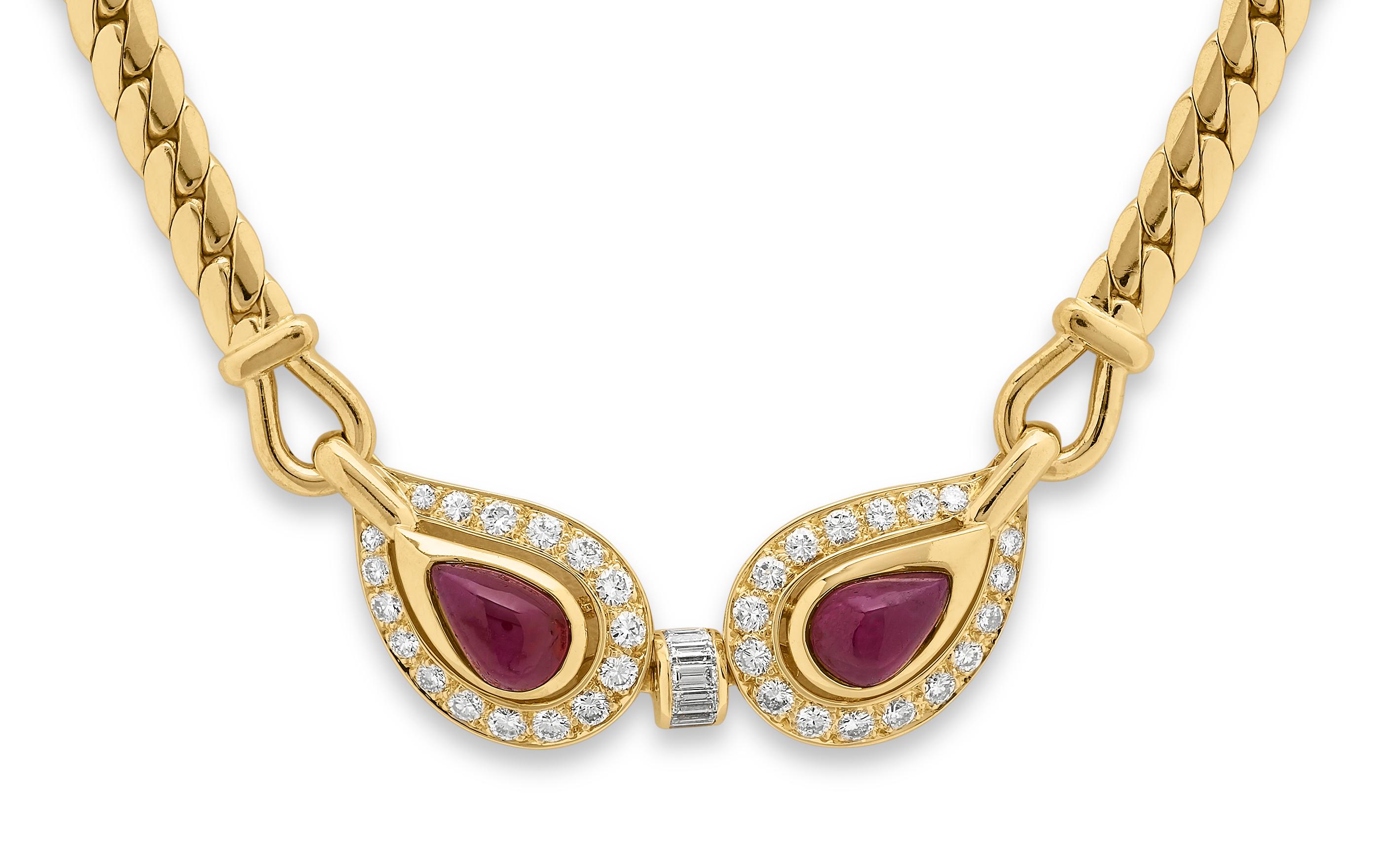 Retro, 1960's ruby and diamond necklace by Cartier, set in 18K yellow gold with original Cartier Pouch. 
2 x pear shape cabochon rubies, approximate total weight 3.0 carats
6 x baguette cut and 32 x round brilliant cut diamonds approximate total