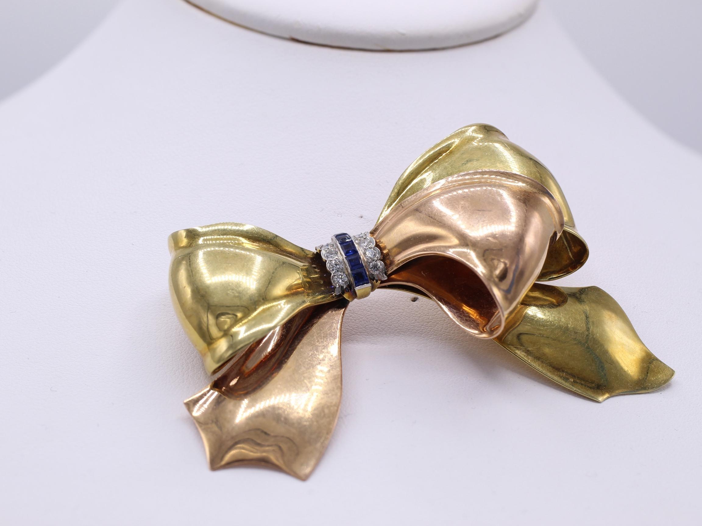 Mixed Cut Cartier Retro Sapphire Diamond Two Color Gold Bow Brooch For Sale