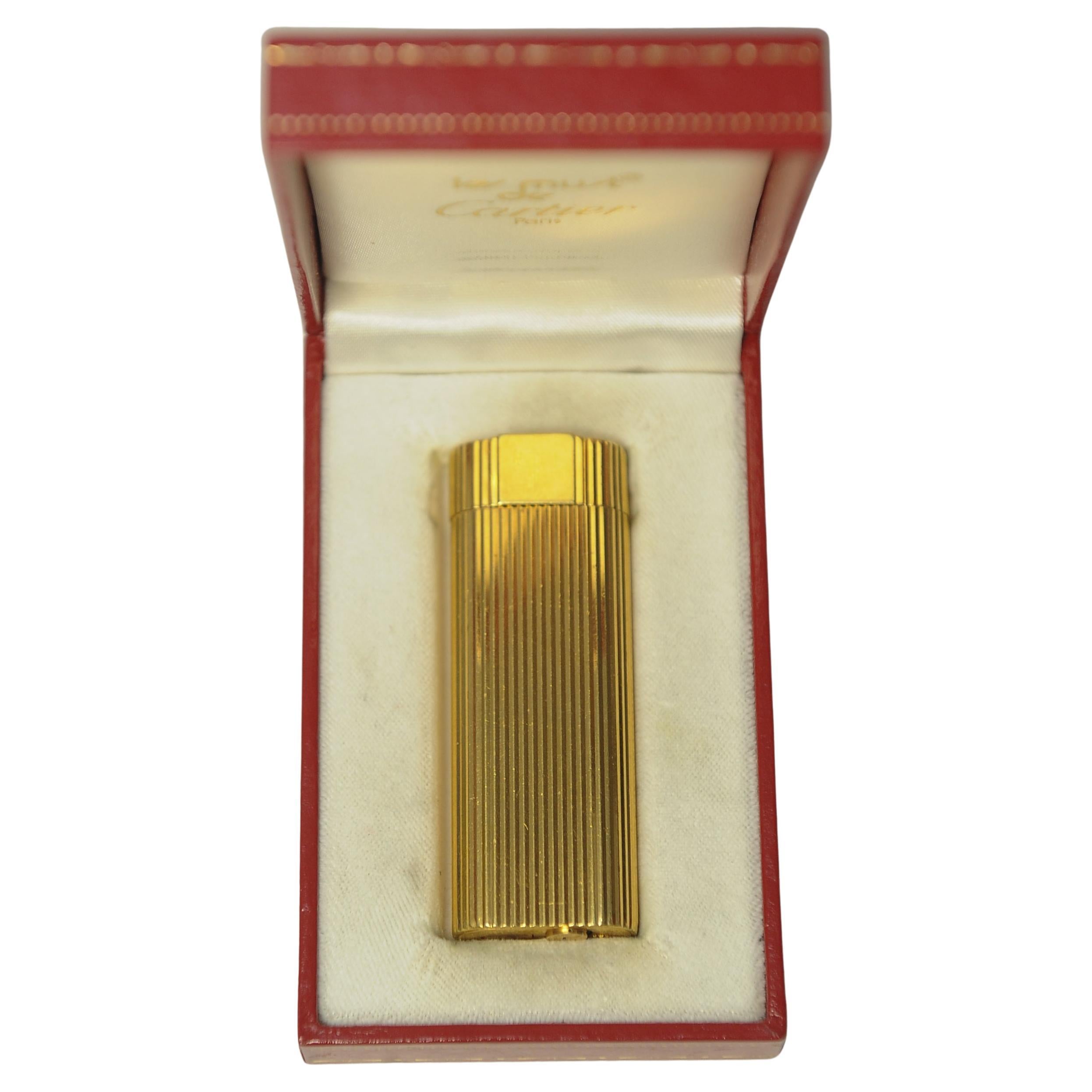 Cartier of Paris Ribbed Gold Plate Cigarette Lighter In Original Monogramed Red Pouch & Cartier Red Box 

Marked Cartier Paris 67394 X To Lighter Base 

.