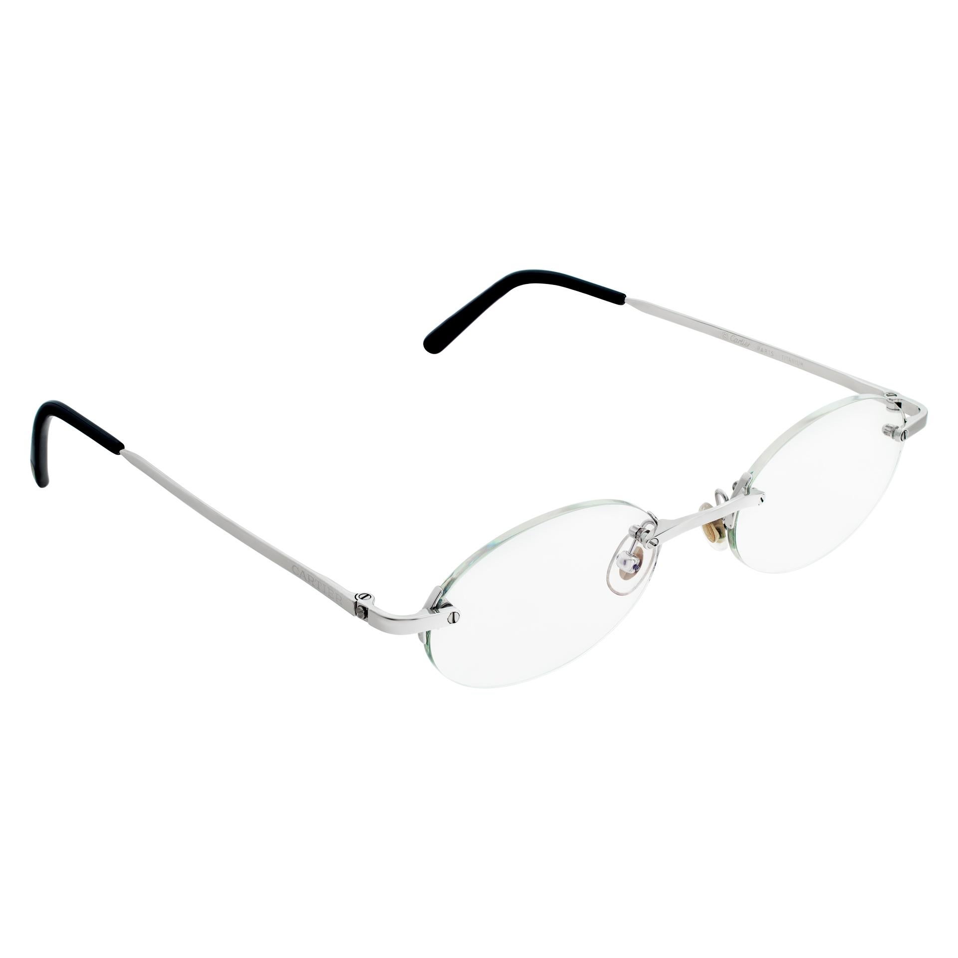 Ovale, randlose Cartier-Brille aus Titan. Gläserbreite 50 mm, Steg 19 mm, Bügellänge 135 mm. Kommt mit Originalverpackung.
