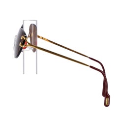 Lunettes de soleil ovales sans monture de Cartier