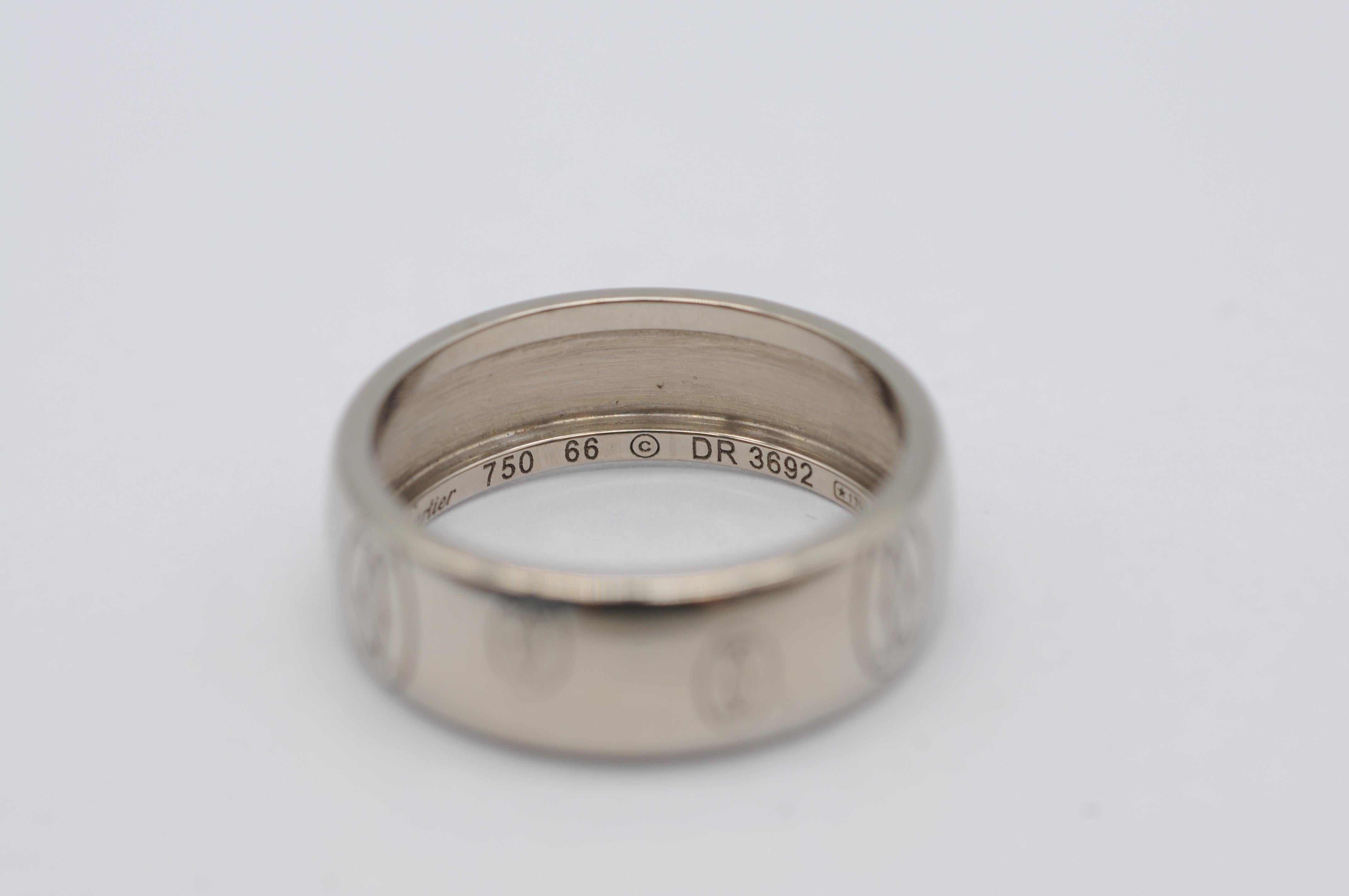 Introducing a magnificent piece of history, a breathtakingly beautiful vintage 18k white gold ring from the renowned house of Cartier. This stunning gentleman's ring, with a size of 66EU, is the epitome of elegance and refinement. Though it bears