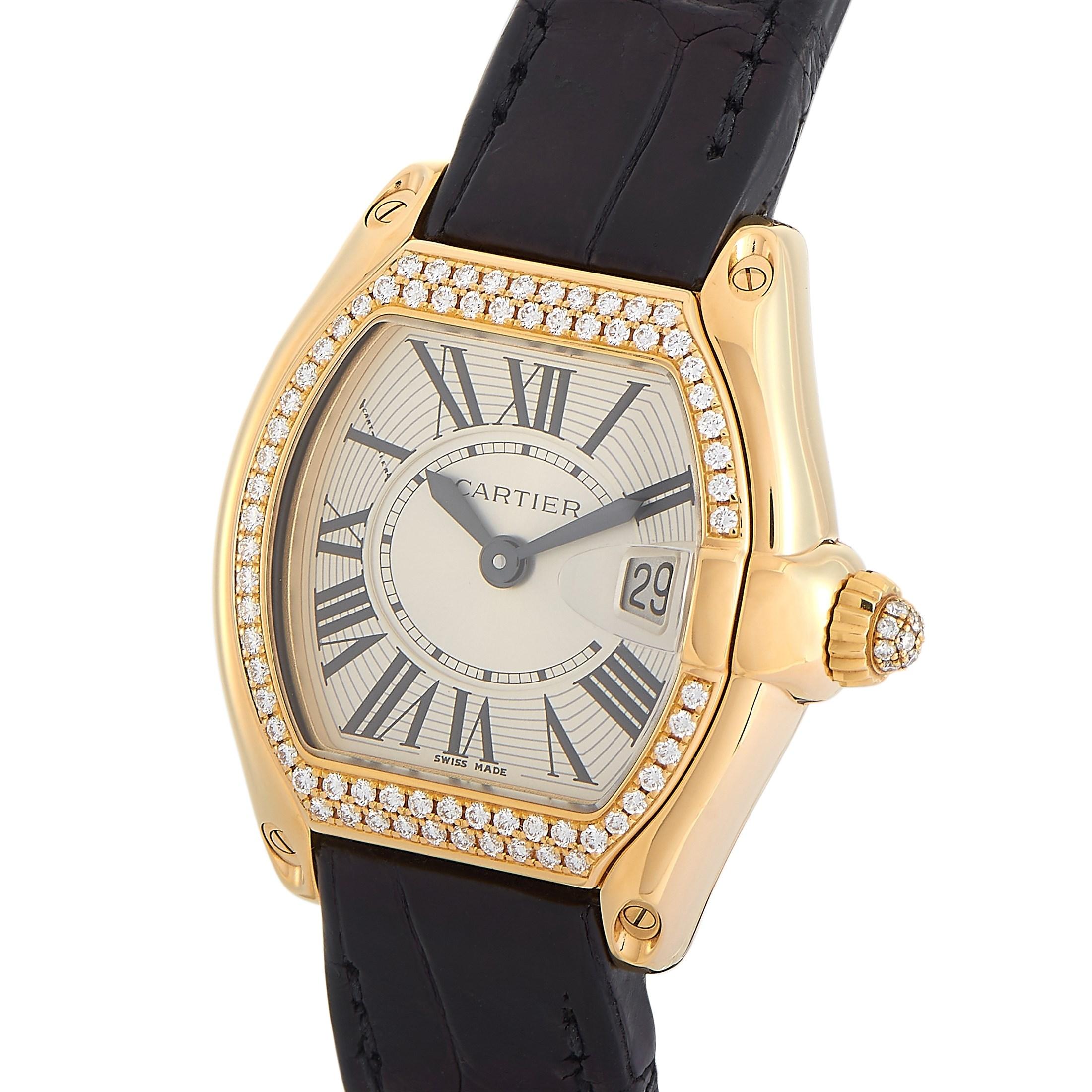 Add some glitter to your wrist with this Cartier Roadster 18K Yellow Gold Diamond Bezel Swiss Quartz Ladies Watch 2676. The 18K yellow gold case measures 31mm by 37mm and features a diamond-set bezel. Even the pull/push crown is set with glittering