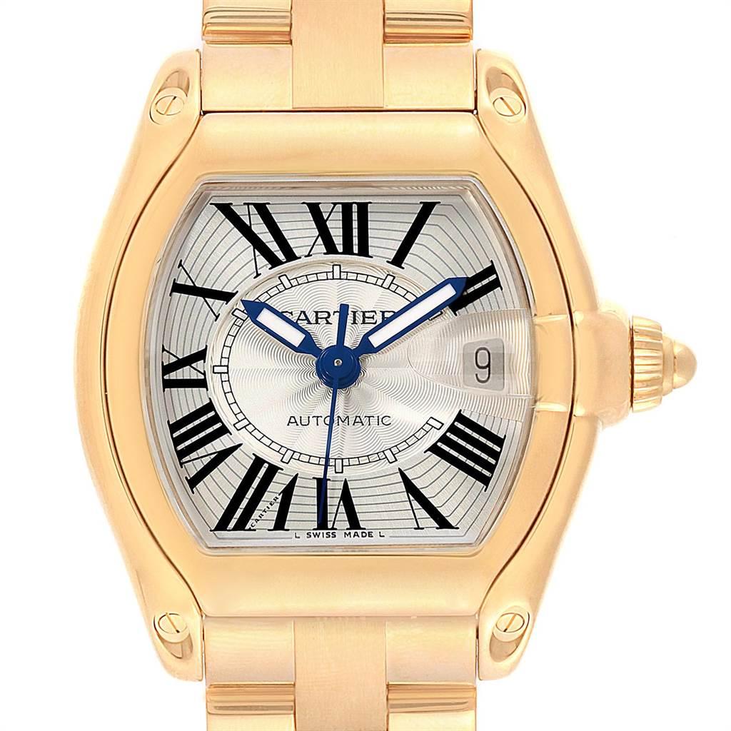 Cartier Roadster 18K Yellow Gold Large Mens Watch W62005V1. Automatic self-winding movement. 18K yellow gold tonneau shaped case 37 x 44 mm. Caseback covered with the clear protective sticker with the red stripe. 18K yellow gold fixed bezel. Scratch