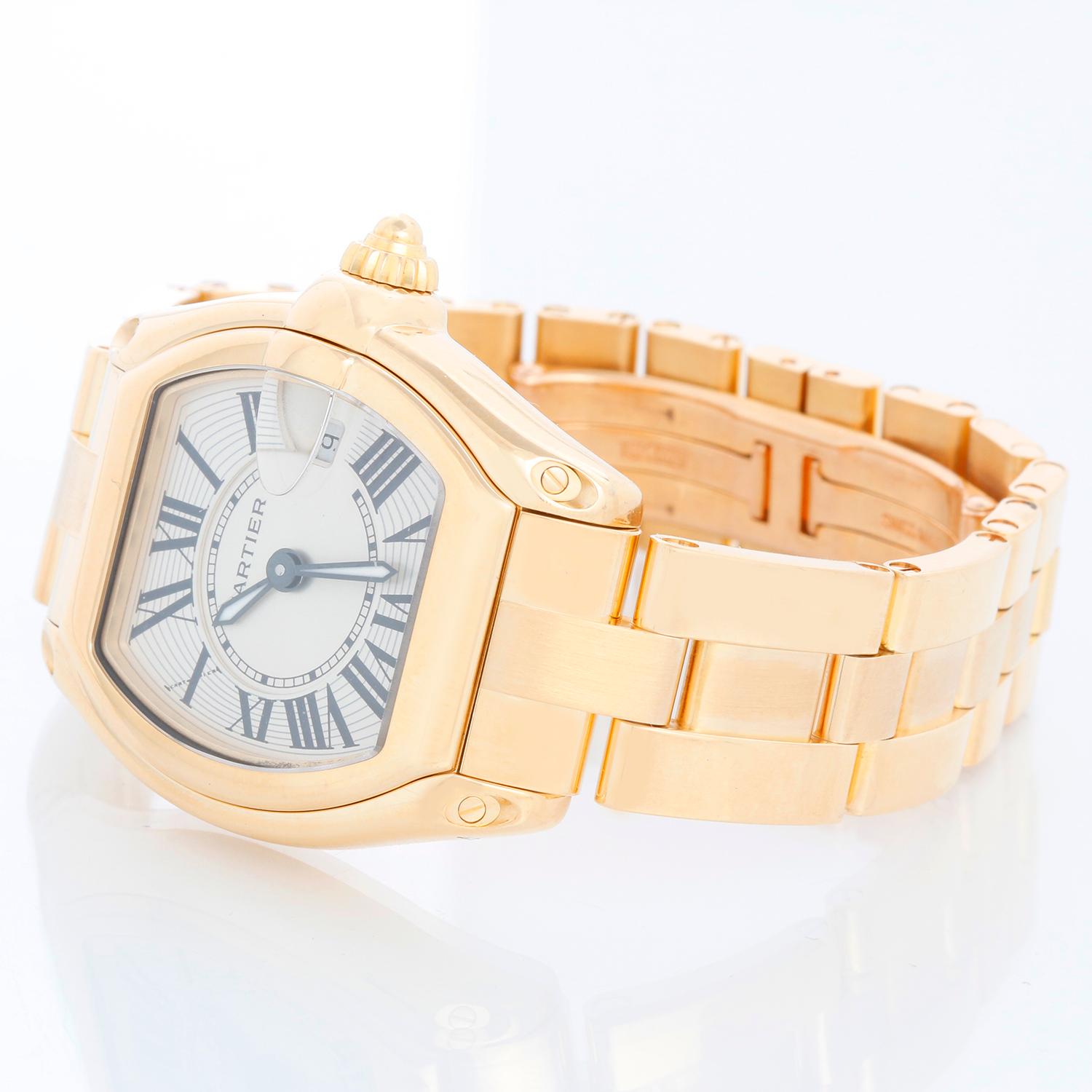 Cartier Roadster 18k Yellow Gold Quartz W620W62018Y18V1 2676 - Quartz. 18k yellow gold tonneau style case (31mm x 37mm). Silver guilloche dial with black Roman numerals; date at 3 o'clock. 18k yellow gold Cartier bracelet with deployant clasp.