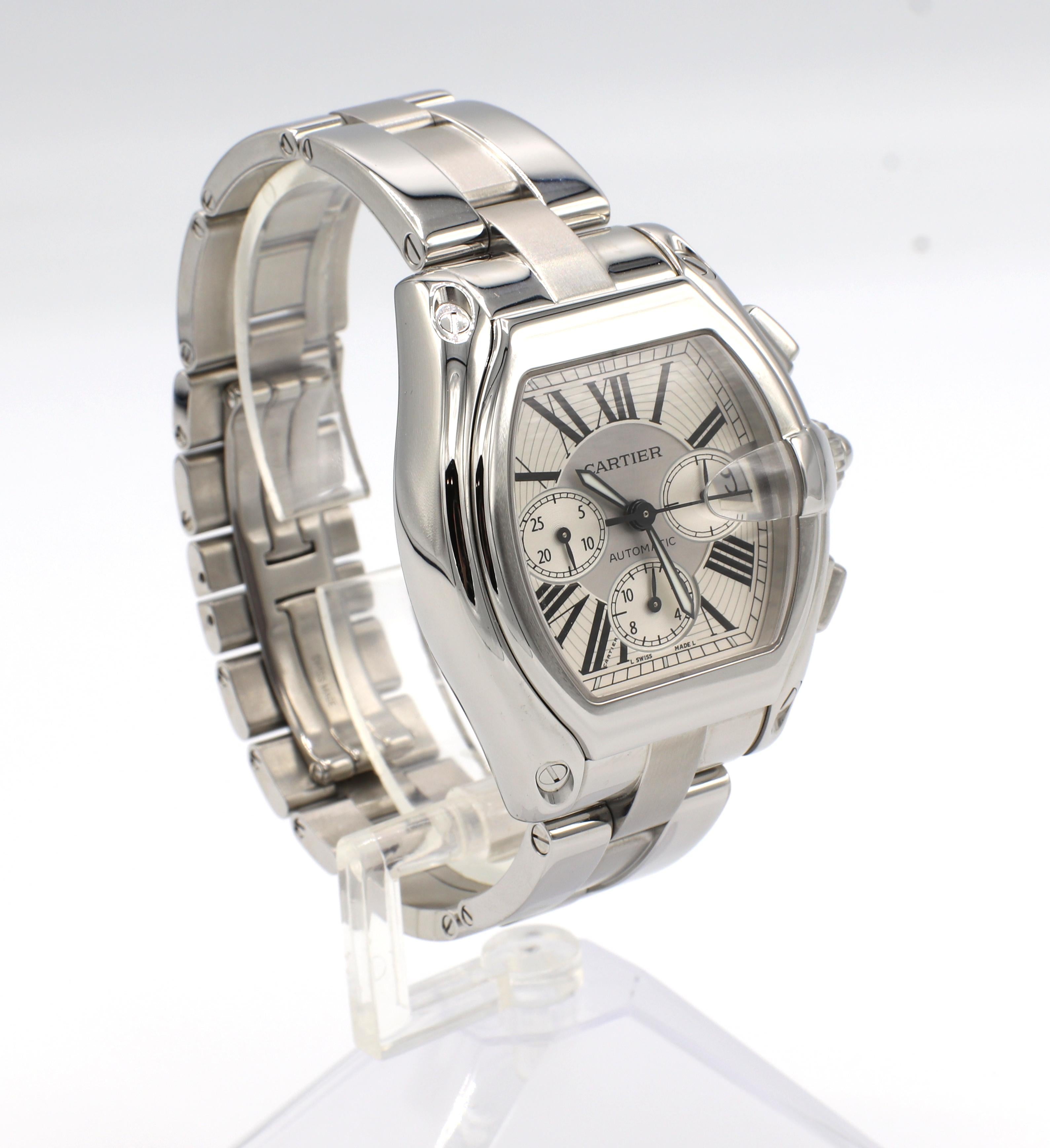 Cartier Roadster 2618 Automatic Stainless Steel Chronograph Watch 
Model: 2618 W62019X6
Case: 43 x 48mm
Metal: Stainless steel
Movement: Automatic
Features: Date, chronograph
Crystal: Sapphire
Dial: Silver 
Fits approx. 7.75