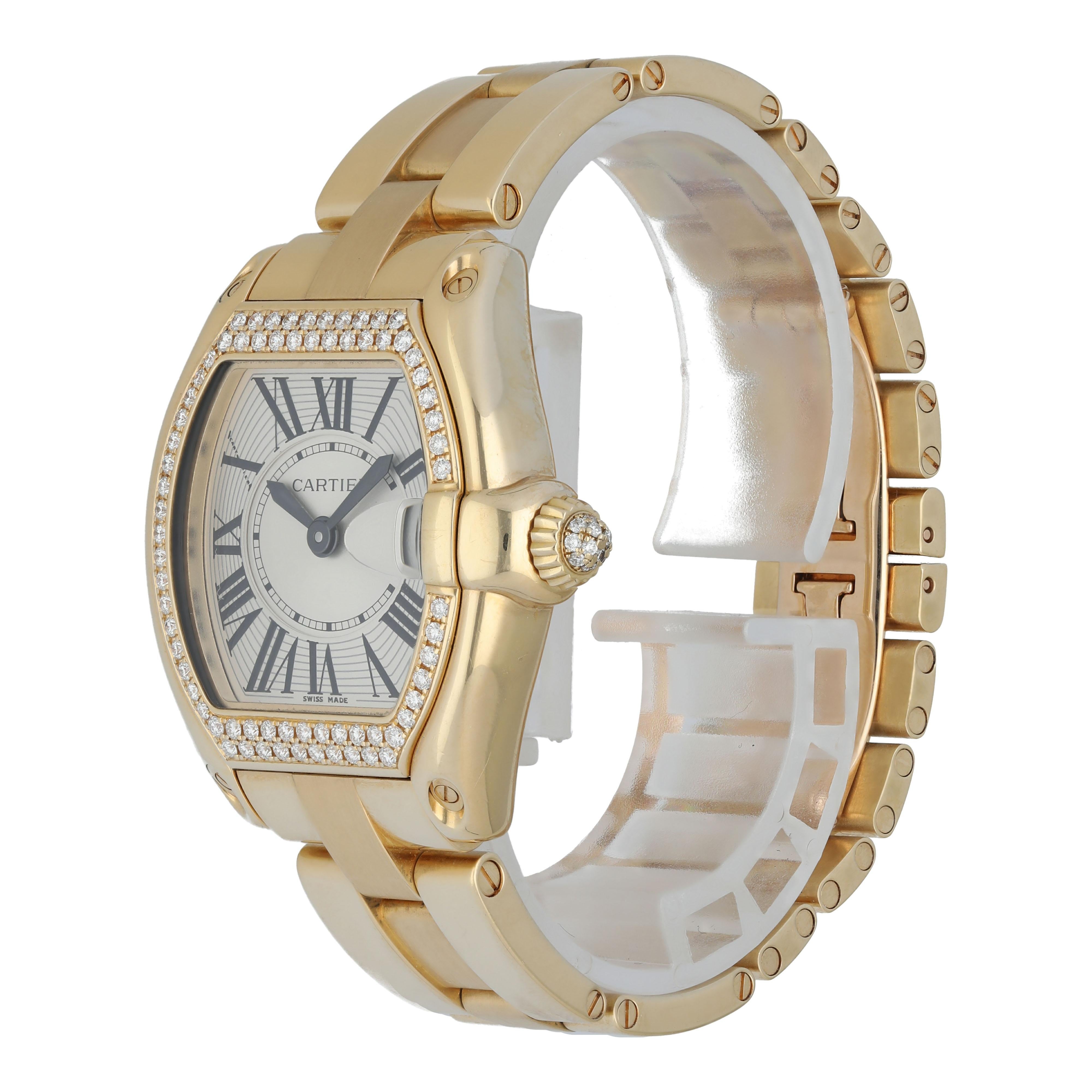 Cartier Roadster 2676 Ladies Watch. 
32mm 18k Yellow gold case.
Yellow Gold factory set diamond bezel and crown. 
Silver dial with Roman numeral hour markers. 
Minute markers on the inner dial. 
Date display at the 3 o'clock position. 
Yellow Gold