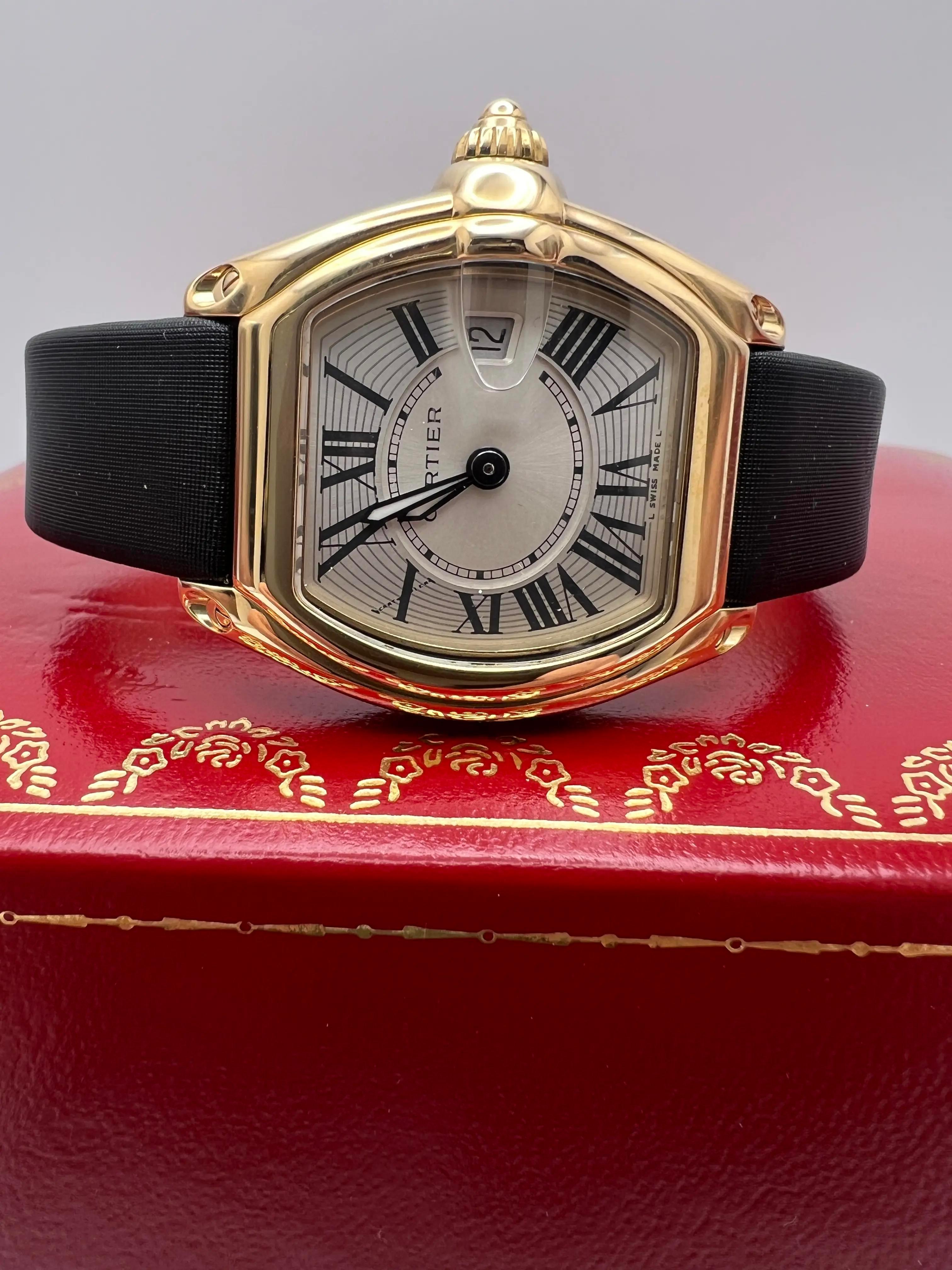 Pristine condition Cartier Roadster W62018Y5 is a sophisticated timepiece that embodies the brand's commitment to blending classic design with luxurious craftsmanship. Crafted from solid 18K yellow gold, the 31mm tonneau-shaped case features