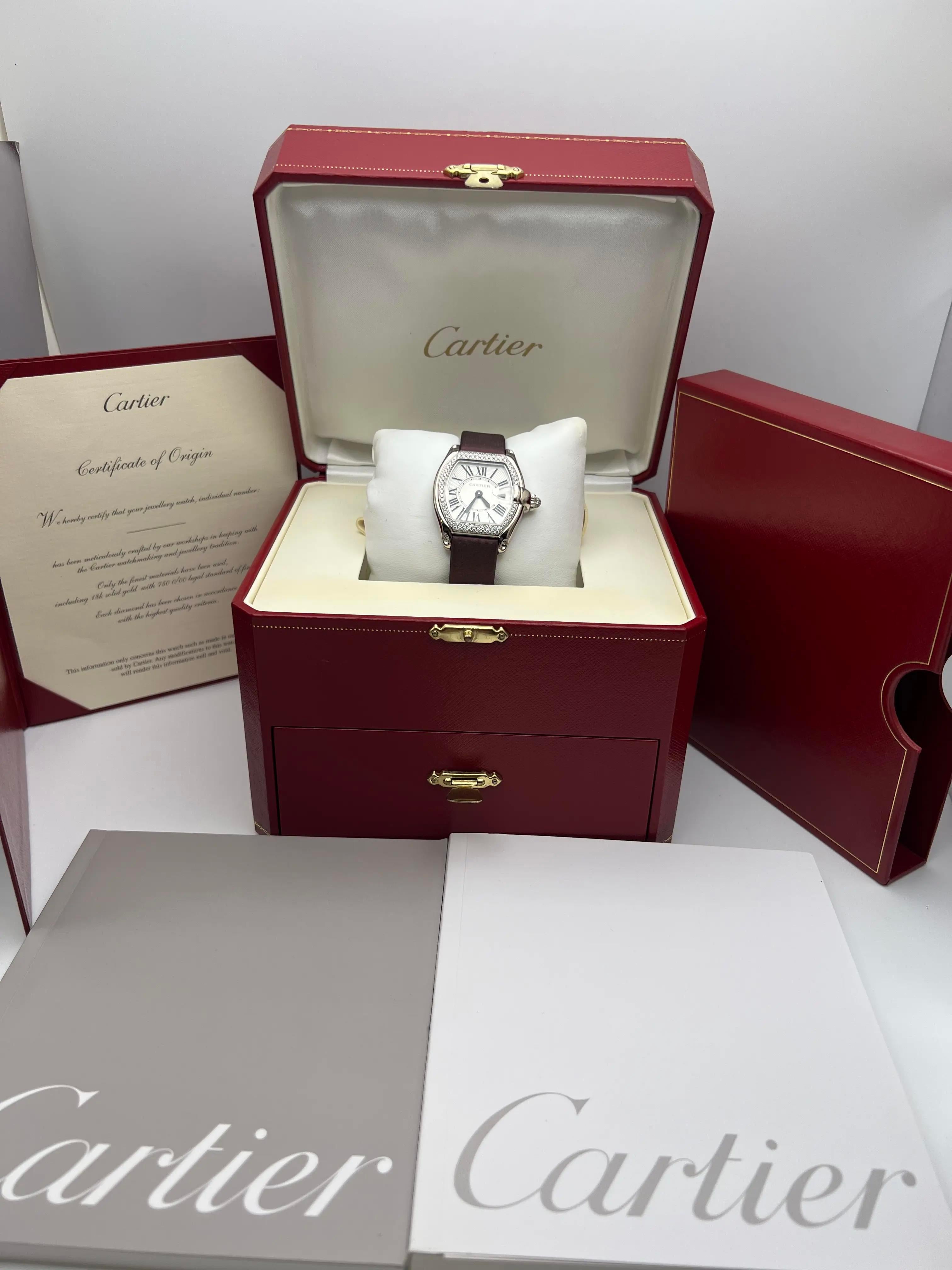 Pristine condition Cartier Tank Française WE500260, featuring an elegant 18k white gold case measuring 31 x 37mm beautifully accented by a factory-set diamond bezel. The sophisticated silvered dial is adorned with classic black Roman numerals and