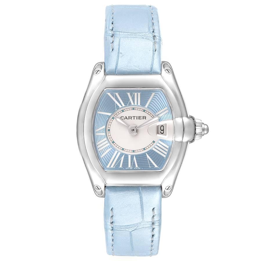 Cartier Roadster Blue Dial Blue Strap Steel Ladies Watch W62053V3. Swiss quartz movement. Stainless steel tonneau shaped case 36 x 30 mm. . Scratch resistant sapphire crystal with Cyclops magnifying glass. Light blue dial with white roman numerals.