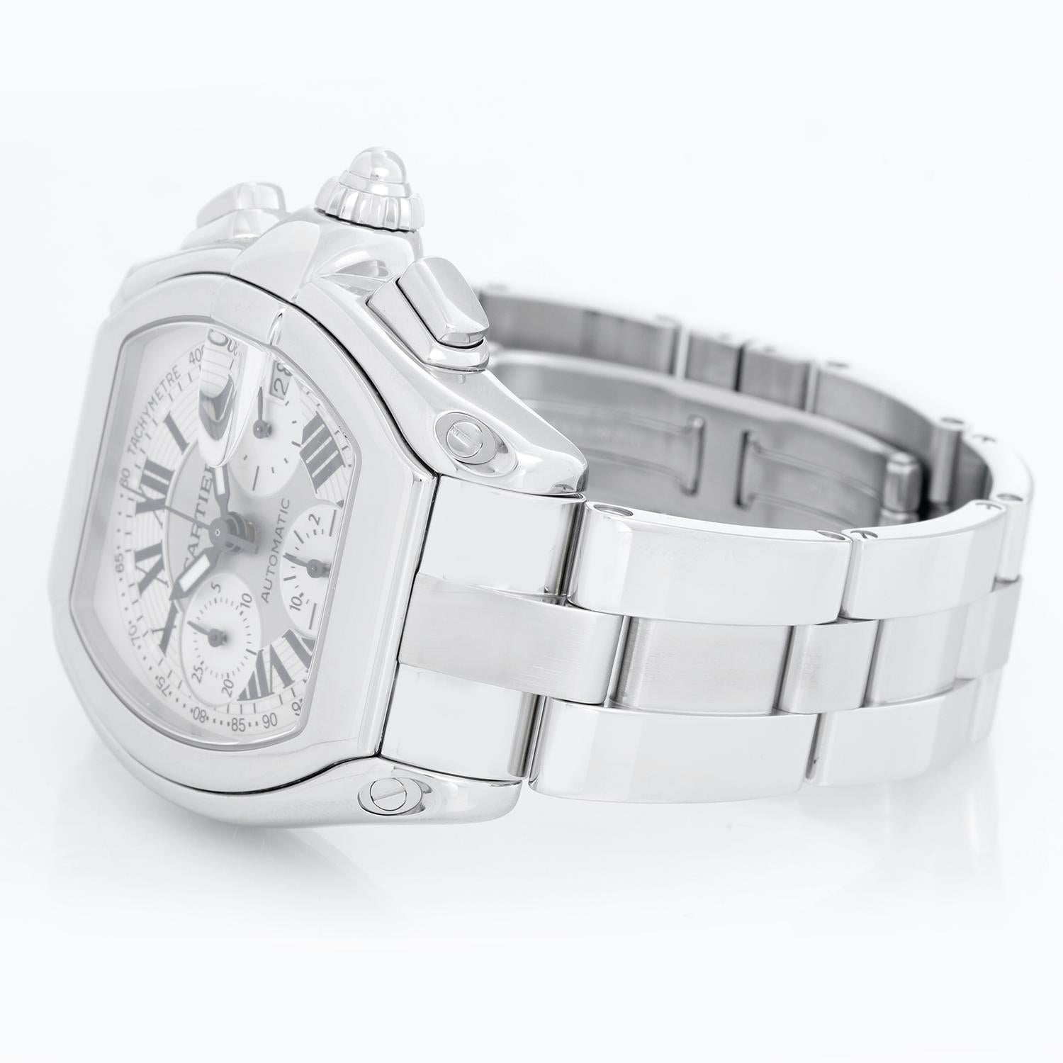 Cartier Roadster Chronograph Men's Stainless Steel Automatic Watch 2618 - Chronograph Automatic winding. Stainless steel case  (43mm x 48mm). Silver dial with Arabic numerals; date at 3 o'clock. Stainless steel Cartier Roadster bracelet with