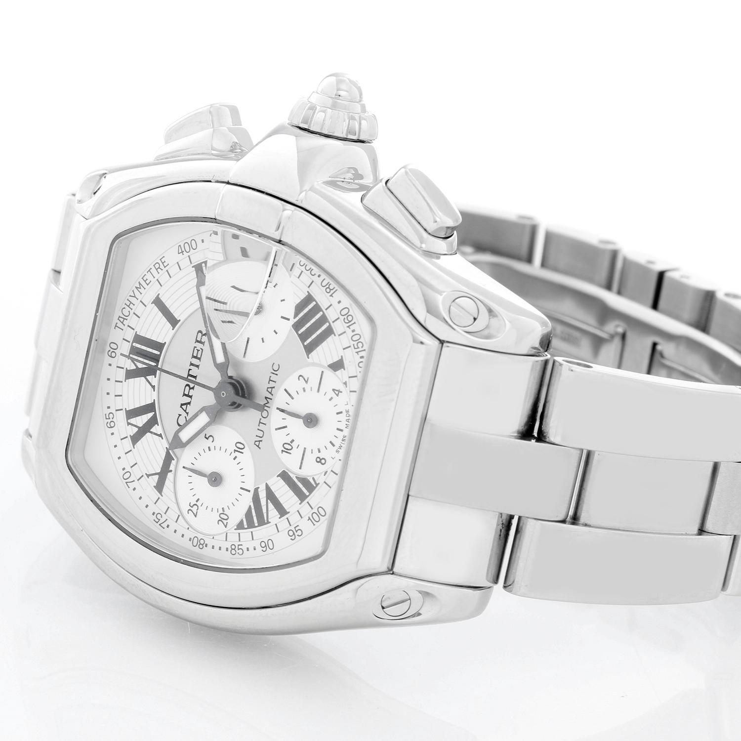 Cartier Roadster Chronograph Stainless Steel Men's Watch - Automatic winding chronograph with date. Stainless steel case (43mm x 48mm). Silver dial with white Roman numerals; date at 3 o'clock. Stainless steel Cartier bracelet with deployant clasp.