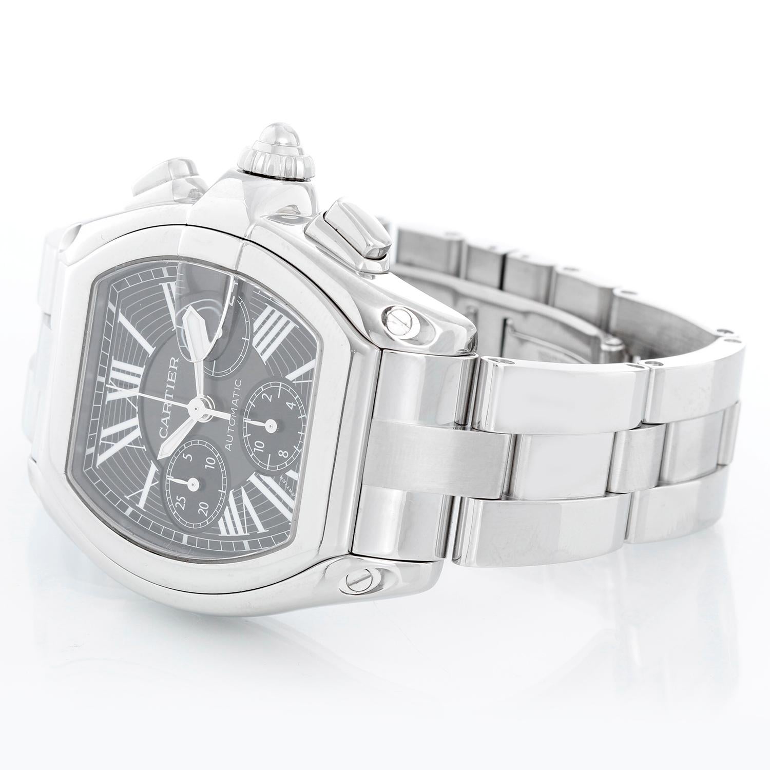 Cartier Roadster Chronograph Stainless Steel Men's Watch W62020X6 2618 - Automatic winding chronograph with date. Stainless steel case (43mm x 48mm). Black dial with white Roman numerals; date at 3 o'clock. Stainless steel Cartier bracelet with