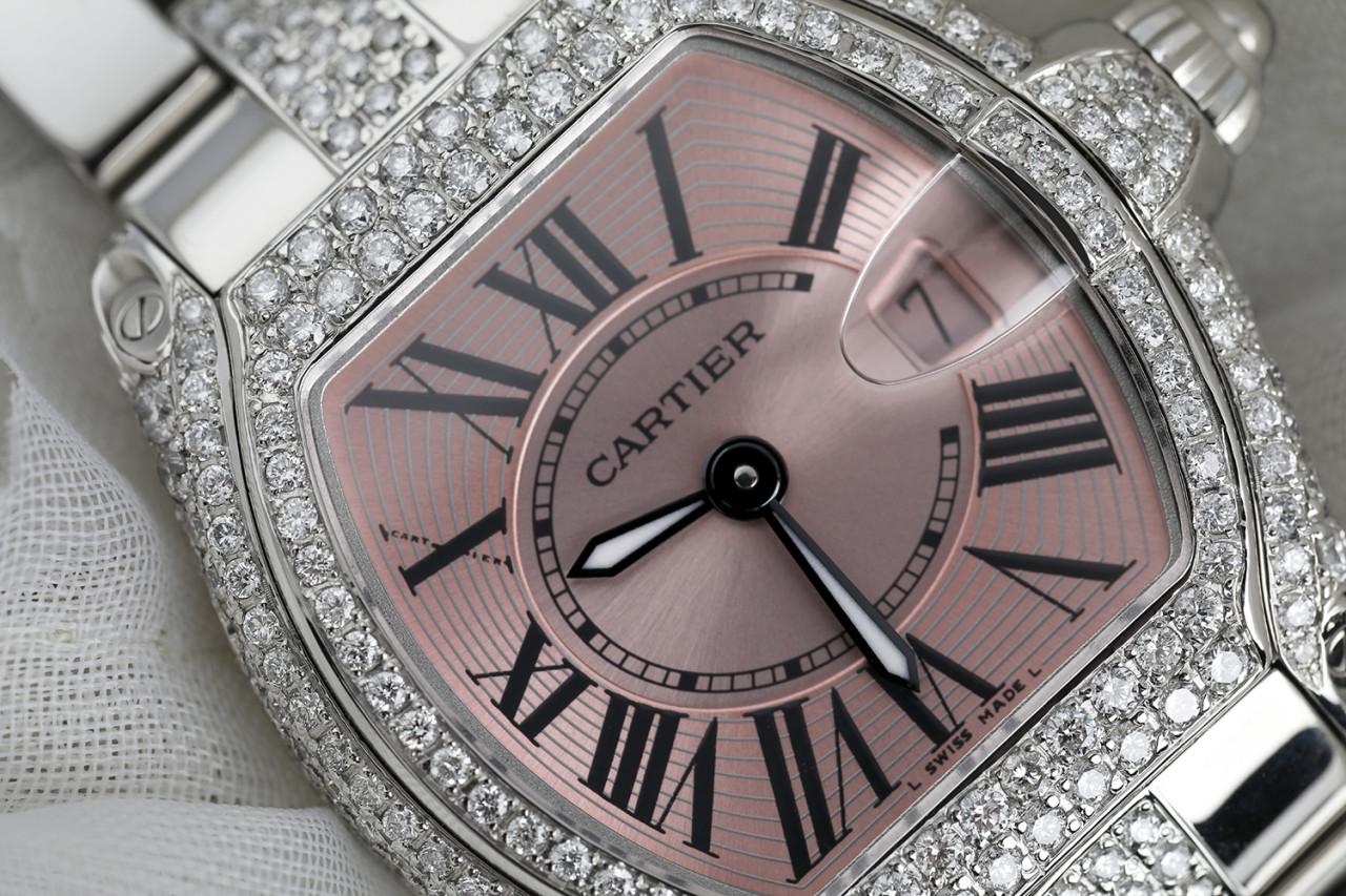 Cartier Roadster Stainless Steel Ladies Watch Diamond Case and Middle Bracelet W62016V3 

Pink-tone dial with luminous hands and black Roman numeral hour markers. Minute markers around an inner ring. Dial Type: Analog. Luminescent hands and dial