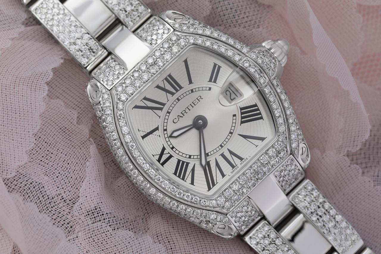 Cartier Roadster Stainless Steel Ladies Watch Diamond Case and Middle Bracelet Silver Dial W62016V3 

Silver-tone dial with luminous hands and black Roman numeral hour markers. Minute markers around an inner ring. Dial Type: Analog. Luminescent