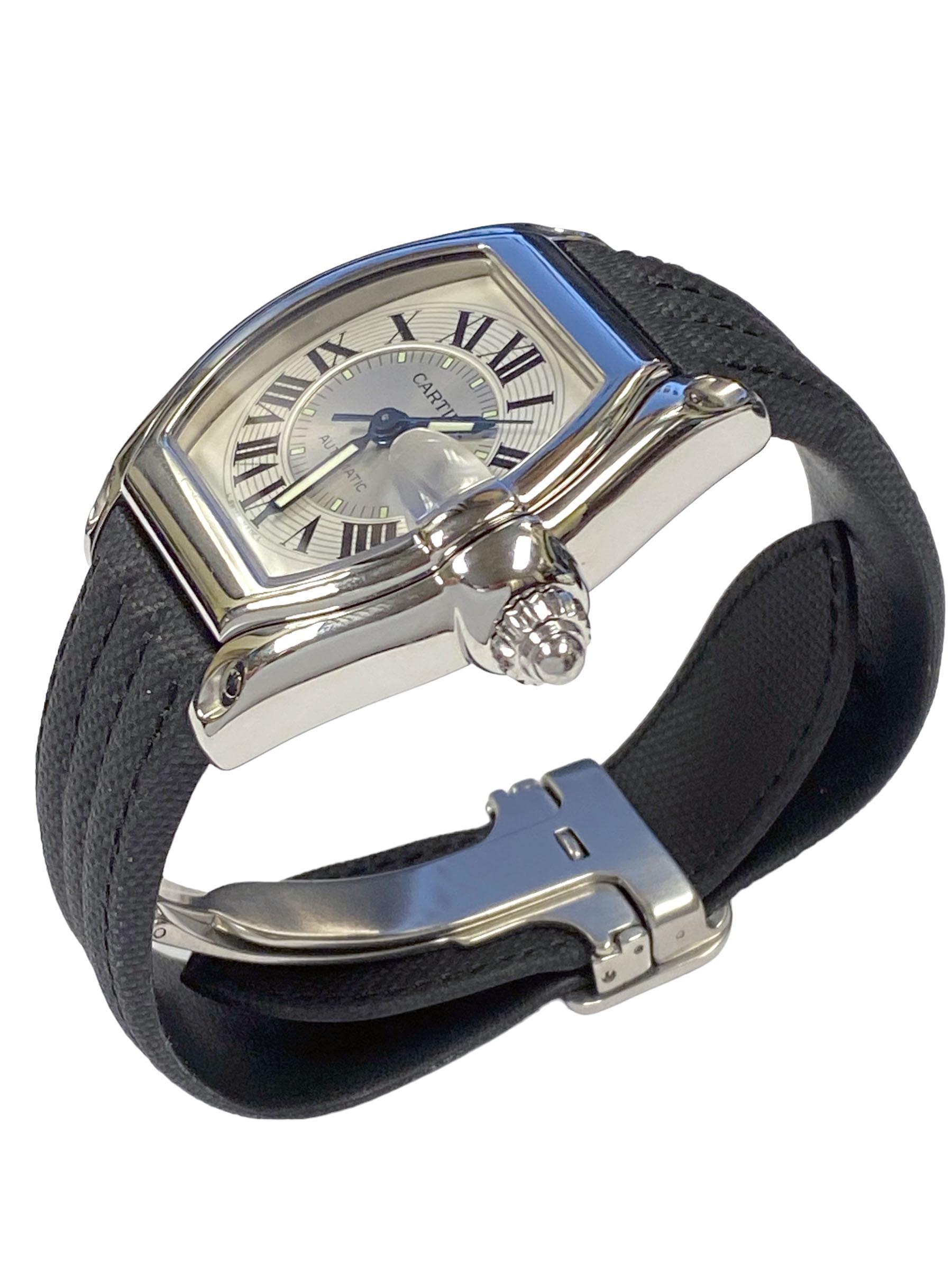 Circa 2010 Cartier Roadster Reference 2510 Wrist Watch, 34 X 37 M.M. Stainless Steel 2 piece Water Resistant case. Automatic, Self winding movement. Silver Satin Double Sunk dial with Black Roman Numerals, sweep seconds hand and a Calendar window at