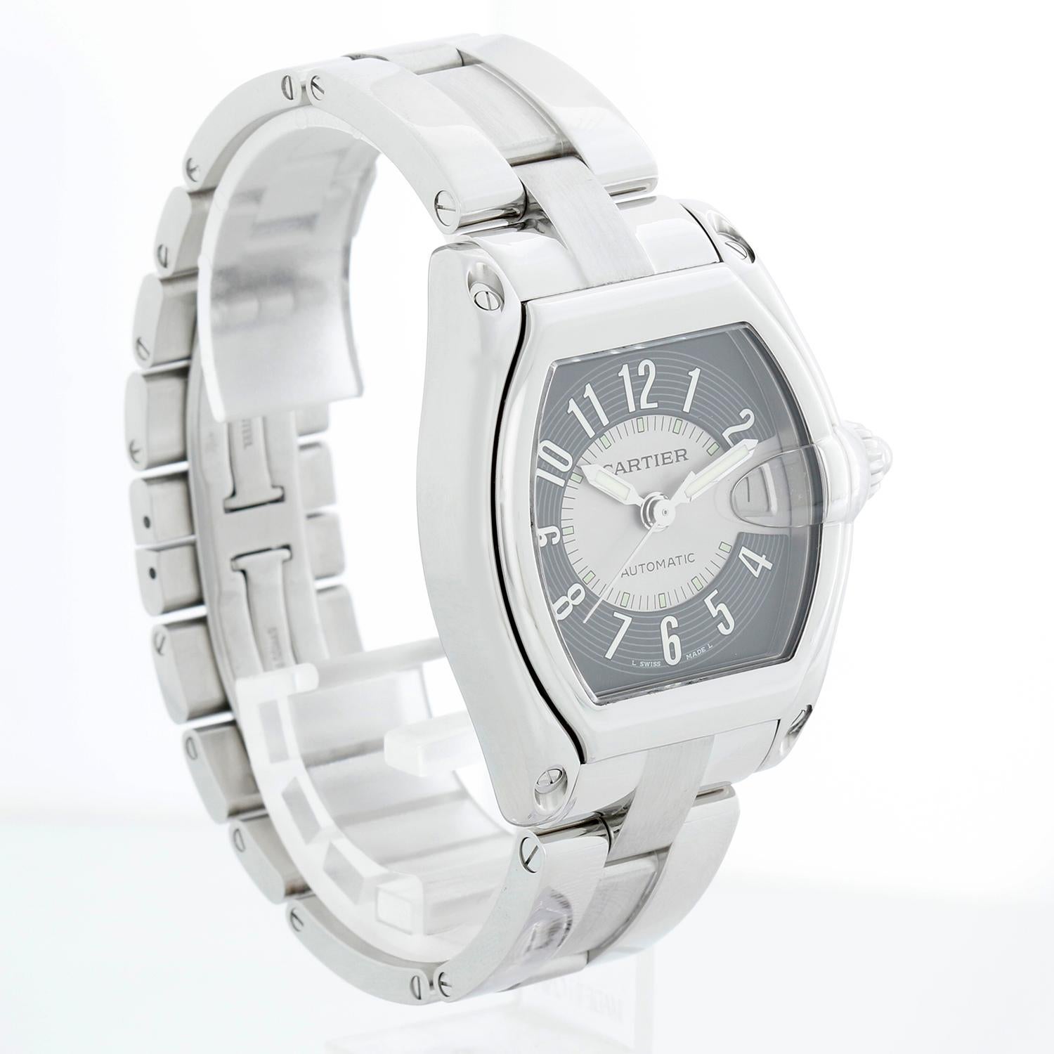 Cartier Roadster Men's Stainless Steel Automatic Watch W62002V3 2510 - Automatic winding. Roadster. Stainless steel case (38mm x 44mm). Black dial with silver center & Arabic numerals; date at 3 o'clock. Stainless steel Cartier Roadster bracelet