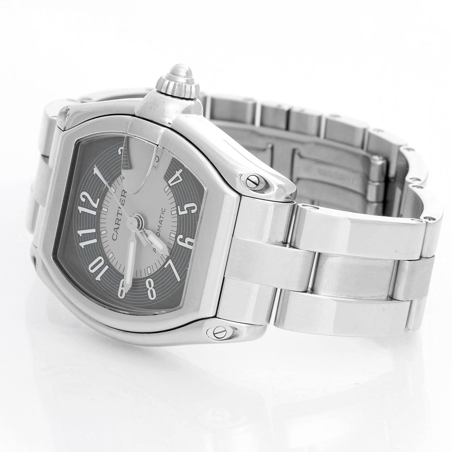 Cartier Roadster Men's Stainless Steel Automatic Watch  W62002V3 - Automatic winding. Stainless steel case  (38mm x 44mm). Gray dial with Arabic numerals; date at 3 o'clock. Stainless steel Cartier Roadster bracelet with deployant clasp. Pre-owned