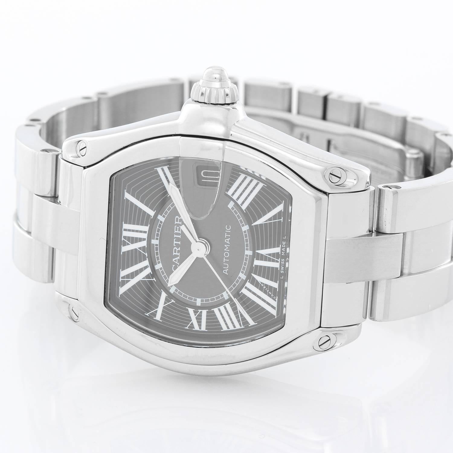 Cartier Roadster Men's Stainless Steel Automatic Watch  W62041V3 -  Automatic winding. Stainless steel case  (38mm x 44mm). Black dial with Arabic numerals; date at 3 o'clock. Stainless steel Cartier Roadster bracelet with deployant clasp. Pre-owned