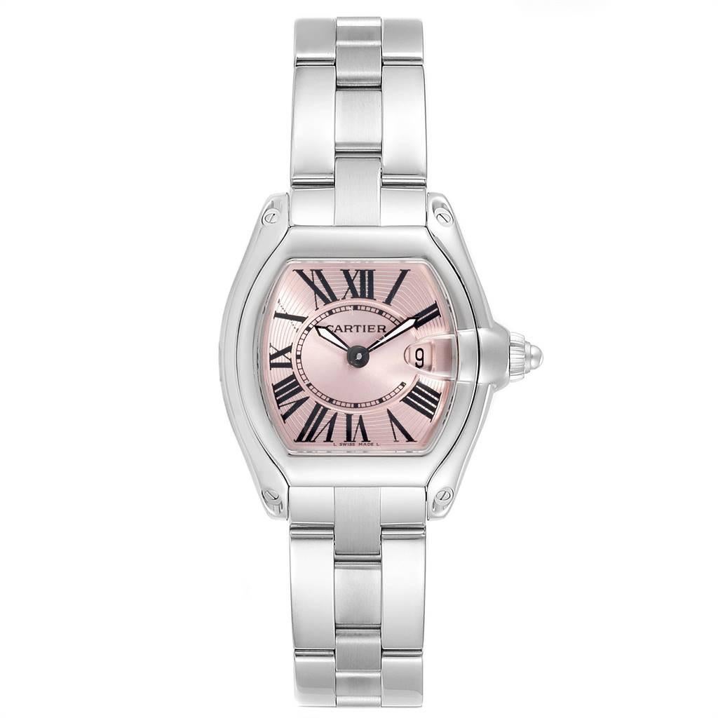 Cartier Roadster Pink Dial Stainless Steel Ladies Watch W62017V3. Swiss quartz movement calibre 688. Stainless steel tonneau shaped case 36 x 30 mm. Scratch resistant sapphire crystal with cyclops magnifying glass. Pink sunray effect dial with black