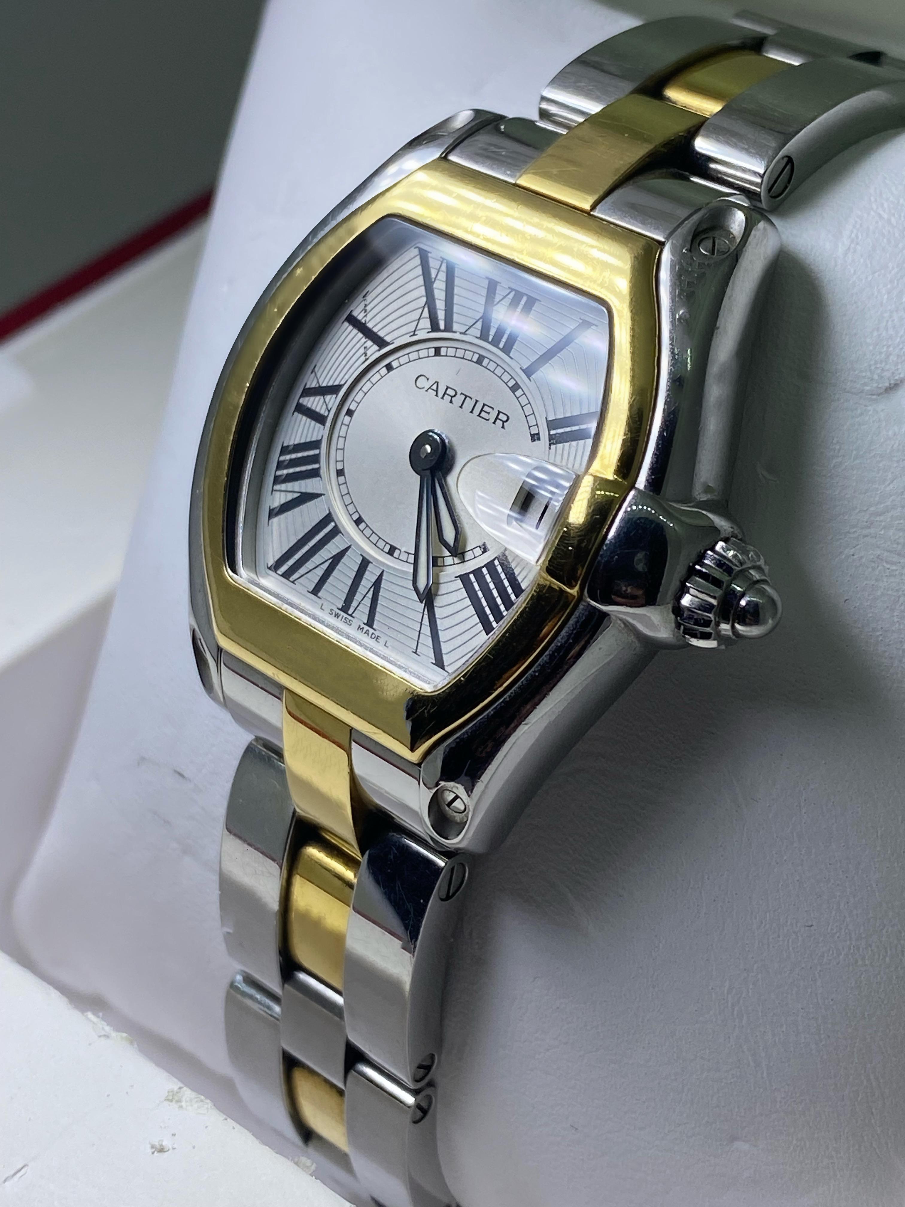 Cartier Roadster ref 2675 Two-Tone Gold & Steel 
is an sophisticated & highly sought after ladies' timepiece

~~~~~~

It features an eye-catching two-tone case,
measuring 32 x 38mm (including lugs)
of elegant tonneau / barrel shape
accented by 18K