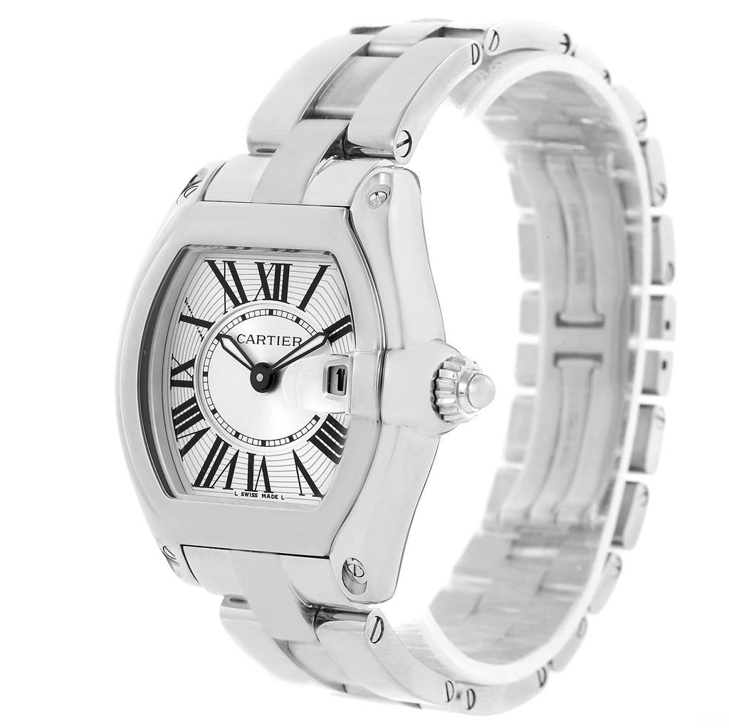 Cartier Roadster Silver Dial Ladies Stainless Steel Watch W62016V3. Swiss quartz movement. Highly polished stainless steel tonneau shaped case 36 x 30 mm. Scratch resistant sapphire crystal with cyclops magnifying glass. Silver sunray effect dial