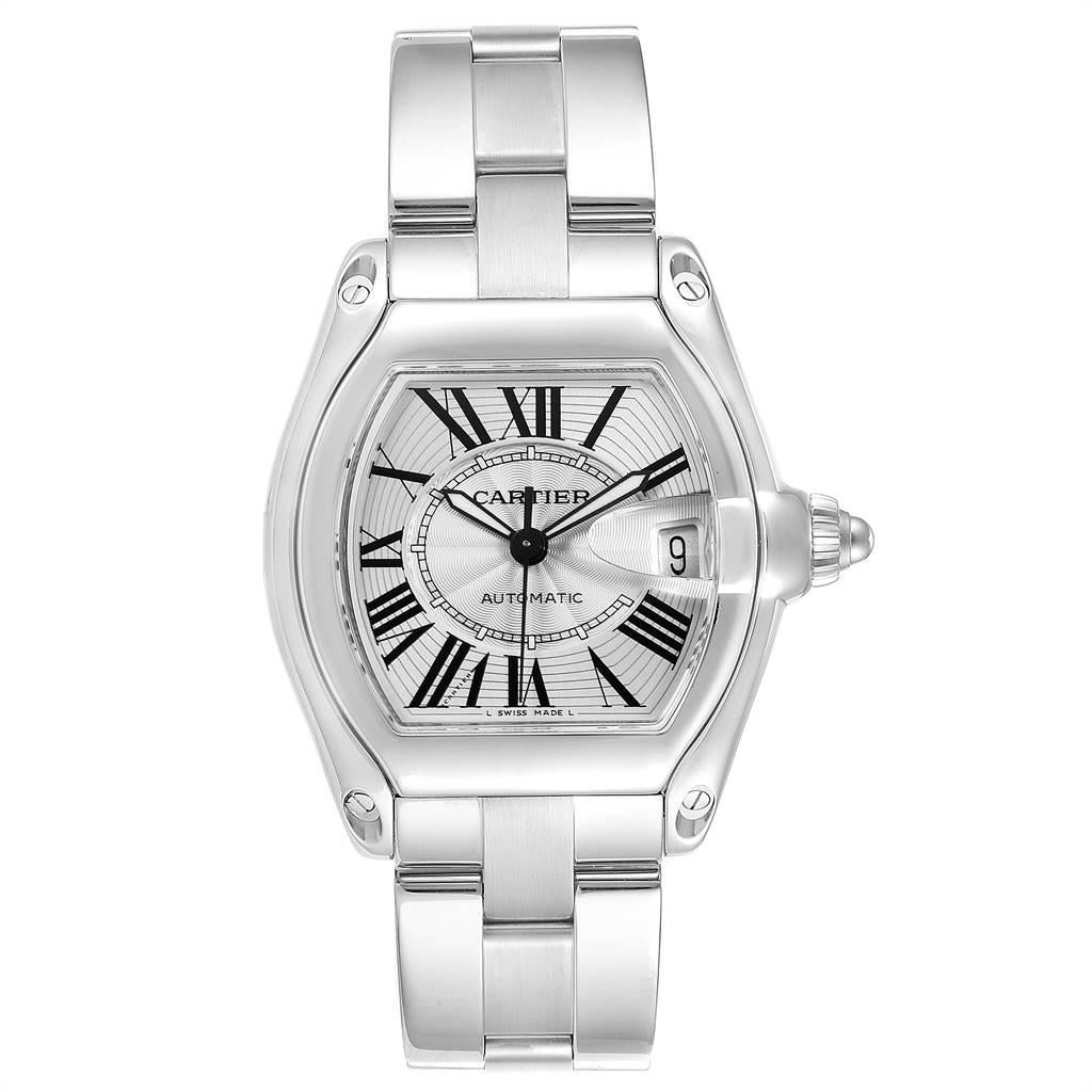Cartier Roadster Silver Dial Large Steel Mens Watch W62025V3. Automatic self-winding movement. Stainless steel tonneau shaped case 38 x 43 mm. Scratch resistant sapphire crystal with cyclops magnifying glass. Silver sunray effect dial with black