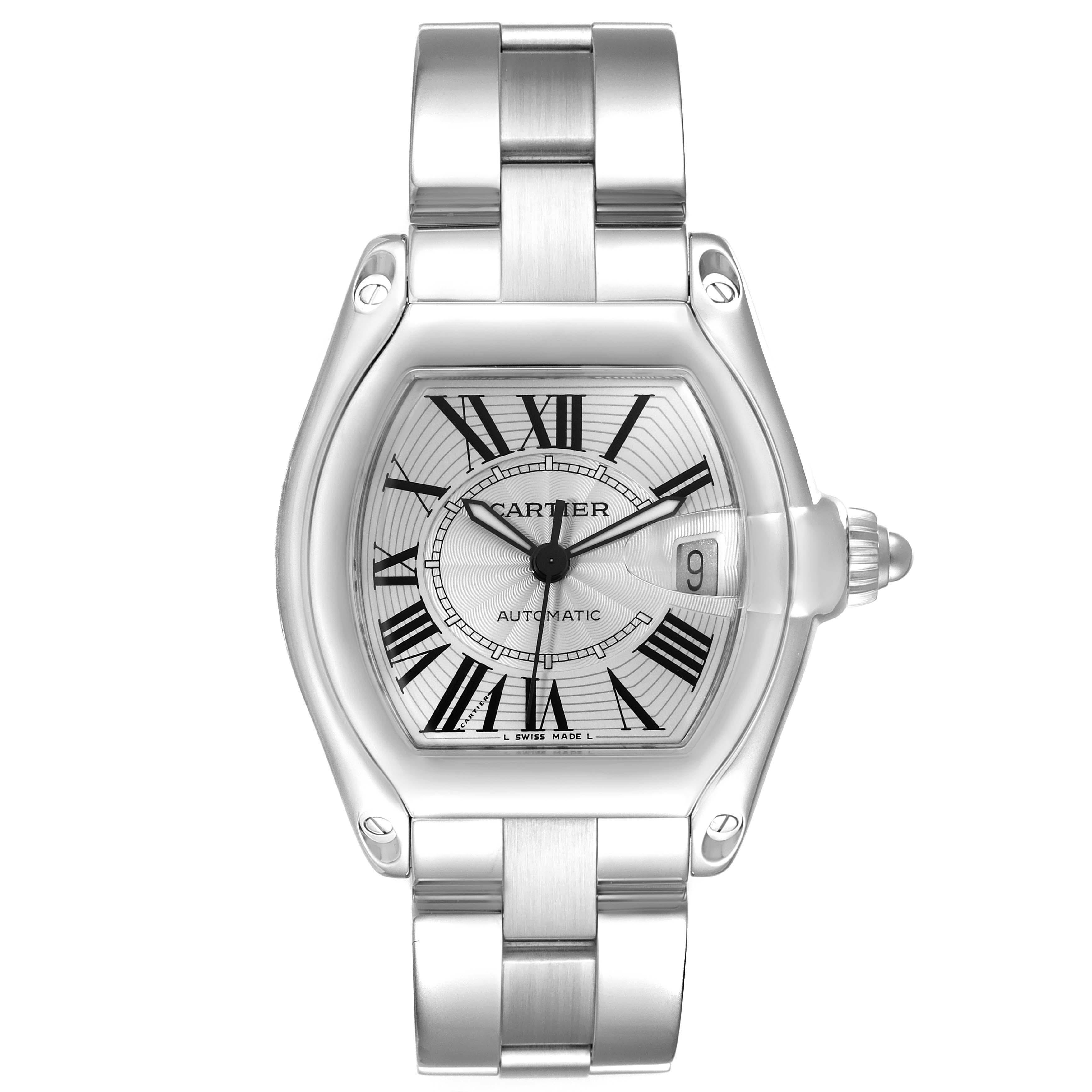 Cartier Roadster Silver Dial Steel Mens Watch W62000V3 Box Papers. Automatic self-winding movement. Stainless steel tonneau shaped case 38 x 43mm. . Scratch resistant sapphire crystal with cyclops magnifying glass. Silver sunray dial with black