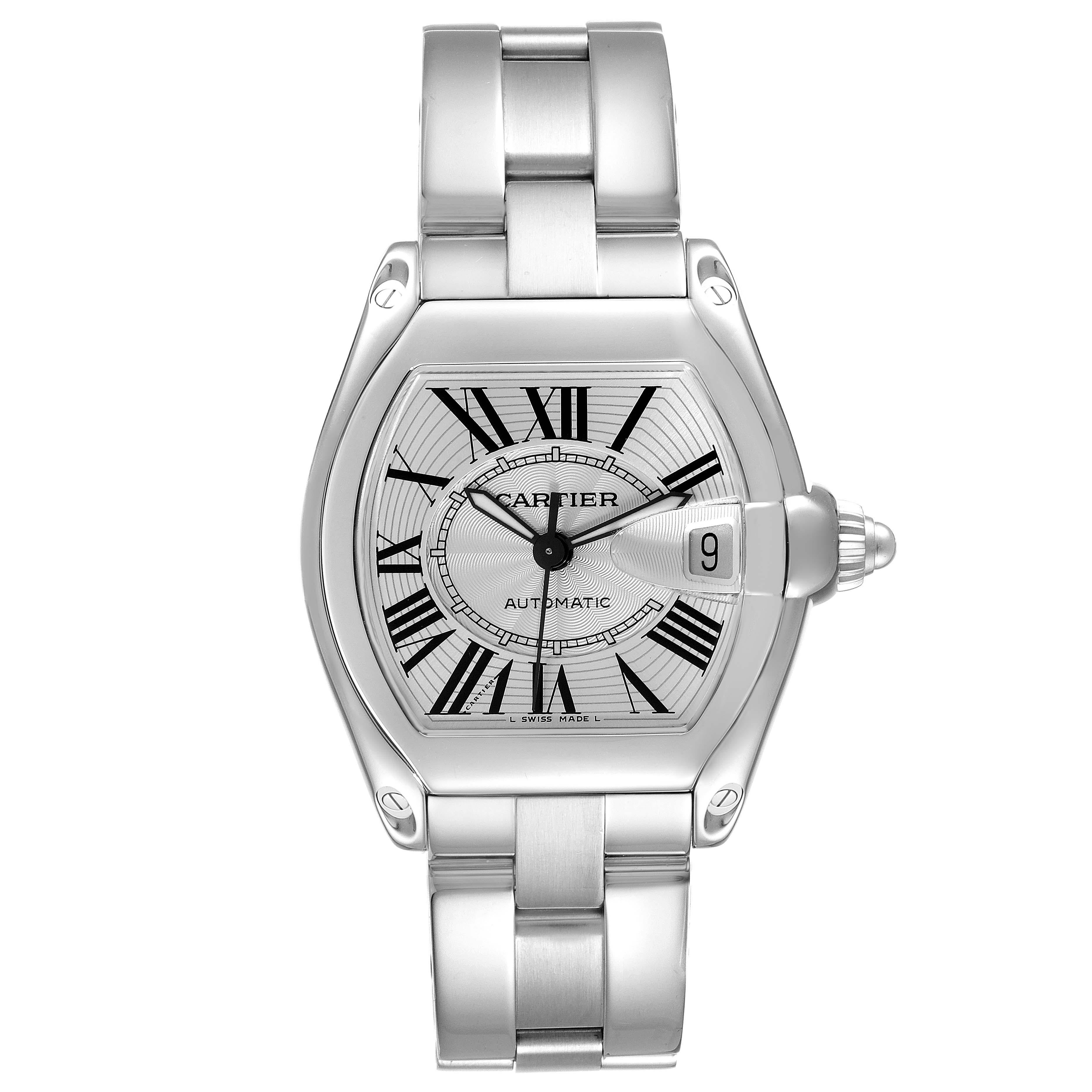 Cartier Roadster Silver Dial Steel Mens Watch W62000V3. Automatic self-winding movement. Stainless steel tonneau shaped case 38 x 43mm. . Scratch resistant sapphire crystal with cyclops magnifying glass. Silver sunray dial with black Roman numerals.