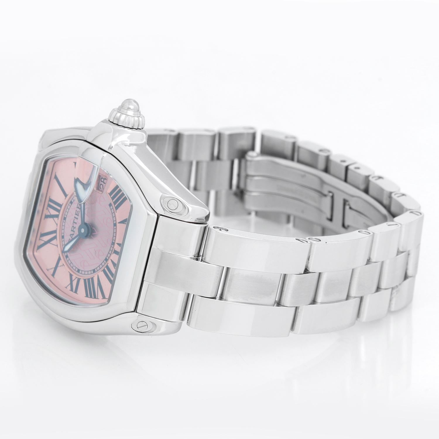 Cartier Roadster Stainless Steel Pink Ribbon Edition Ladies Watch W62016V3 - Quartz. Stainless steel tonneau style case ( 31 x 37 mm) . Pink guilloche dial with ribbons in the center ; date at 3 o'clock. Stainless steel Cartier bracelet with