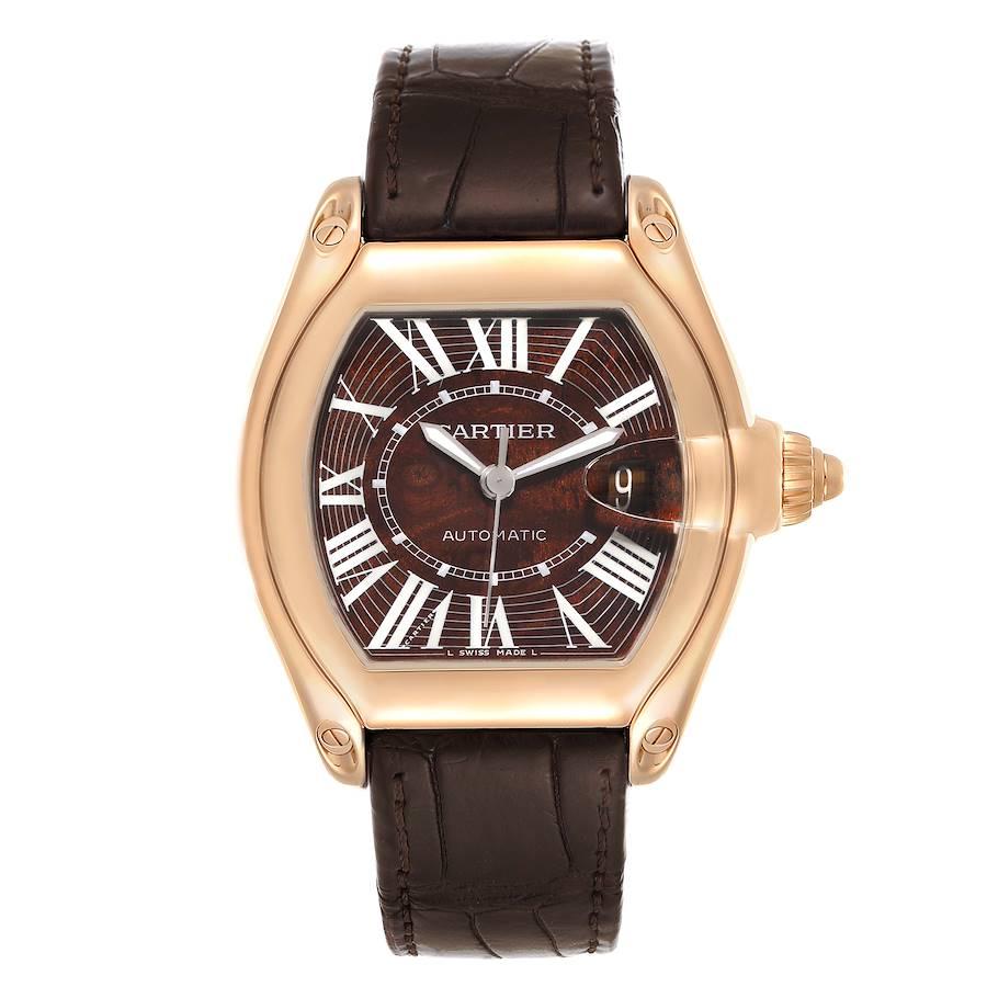 Cartier Roadster XL Rose Gold Walnut Wood Dial Limited Edition Watch W6206001. Automatic self-winding movement. 18K rose gold tonneau shaped case 41 mm x 48 mm. . Scratch resistant sapphire crystal with cyclops magnifying glass. Walnut burl wood