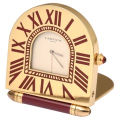Cartier “Romane” Gold Brass and Red Lacquer Travel Clock