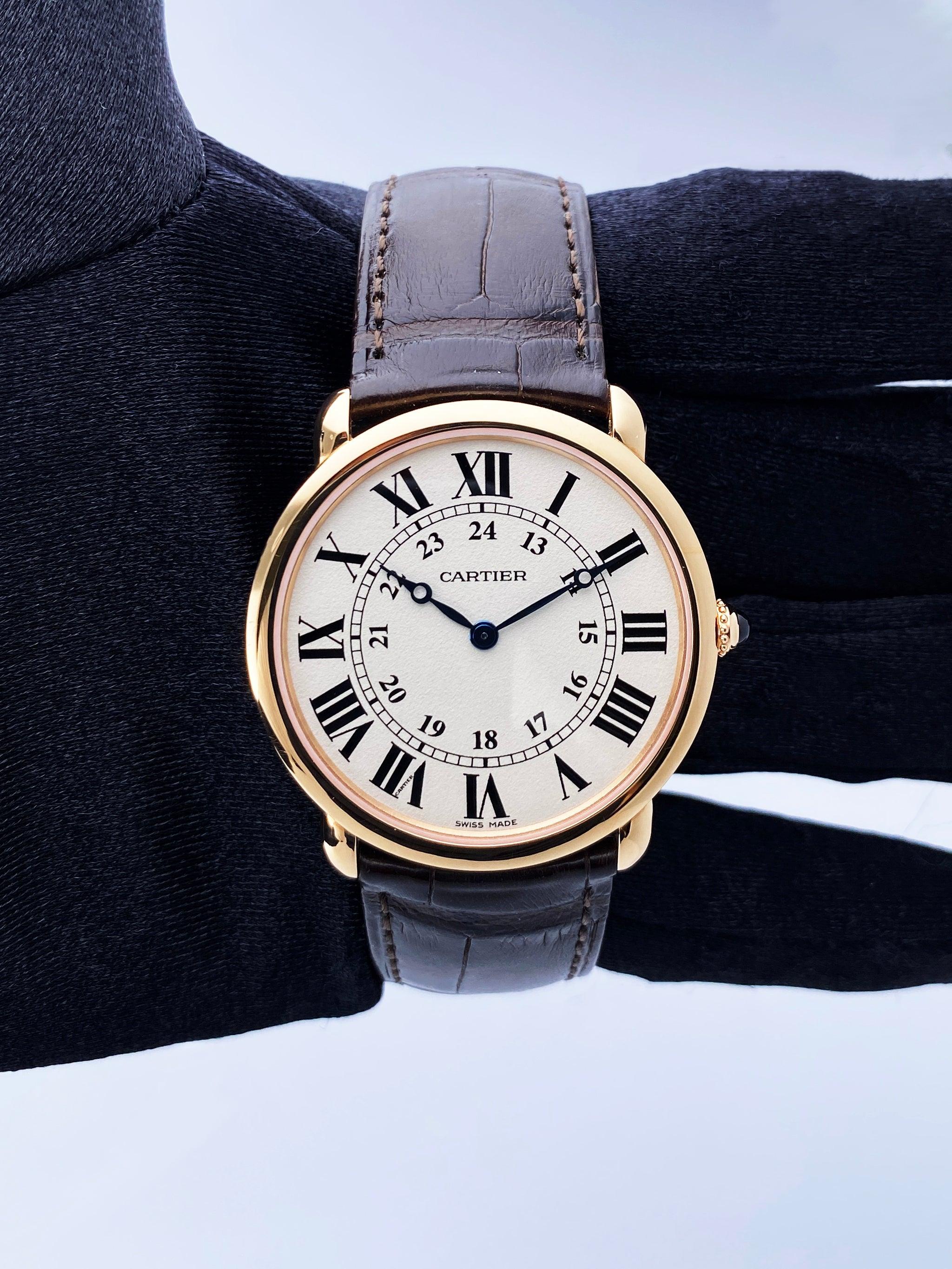 Cartier Ronde Louis W6800251 Watch. 36mm 18K rose gold case. 18K rose gold smoothed bezel. Silver-grained dial with blue hands and black Roman numeral hour markers. Minute markers on the inner dial. Brown alligator leather strap with 18K