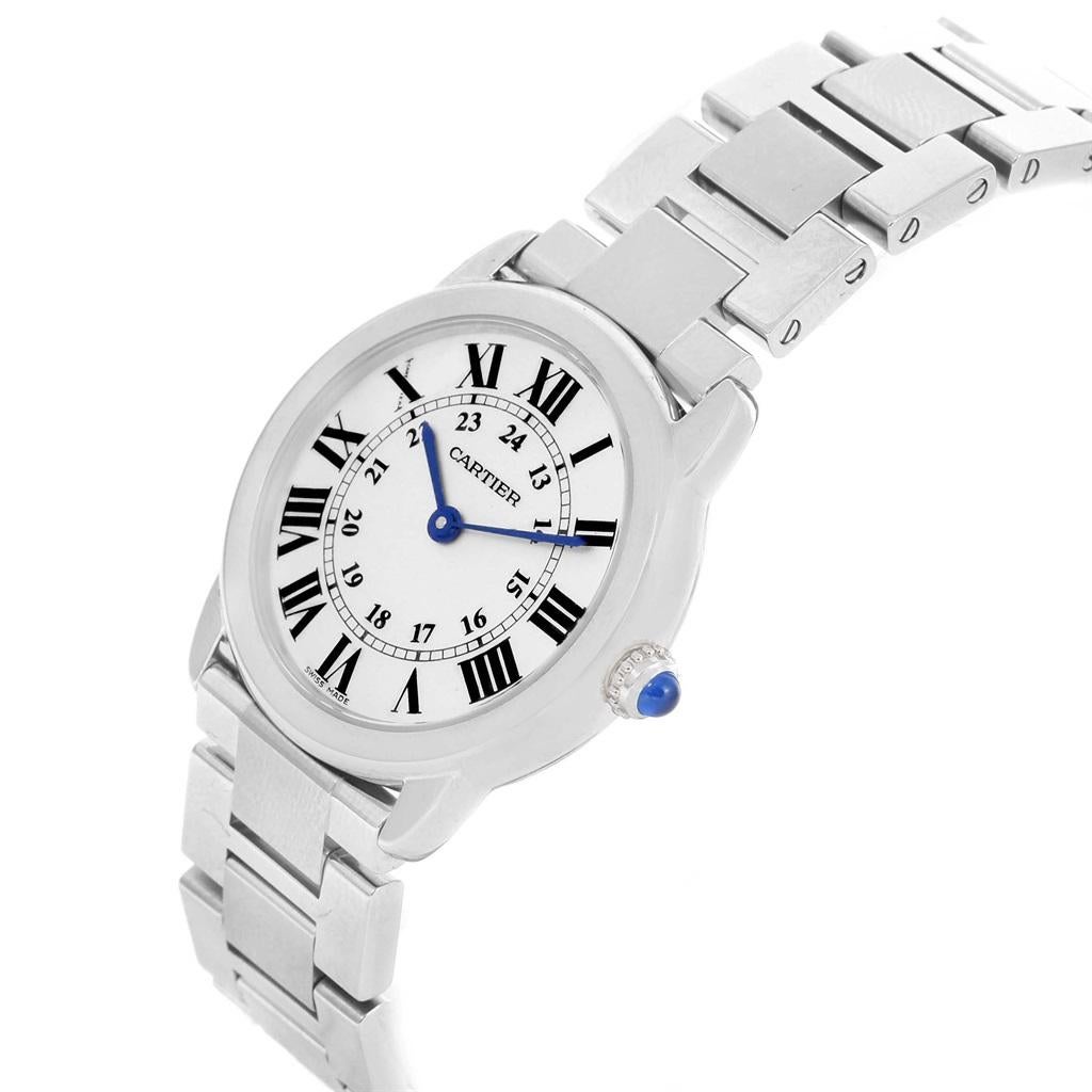 Cartier Ronde Solo Stainless Steel Quartz Ladies Watch W6701004. Quartz movement. Stainless steel case 29 mm in diameter. Circular grained crown set with the blue spinel cabochon. Fixed stainless steel bezel. Scratch resistant sapphire crystal.