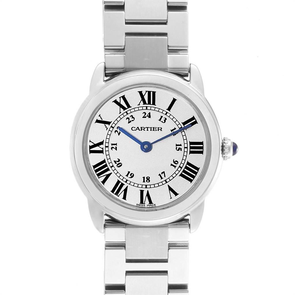 Cartier Ronde Solo Stainless Steel Quartz Ladies Watch W6701004. Quartz movement. Stainless steel case 29 mm in diameter. Circular grained crown set with the blue spinel cabochon. Scratch resistant sapphire crystal. Silvered opaline dial. Painted