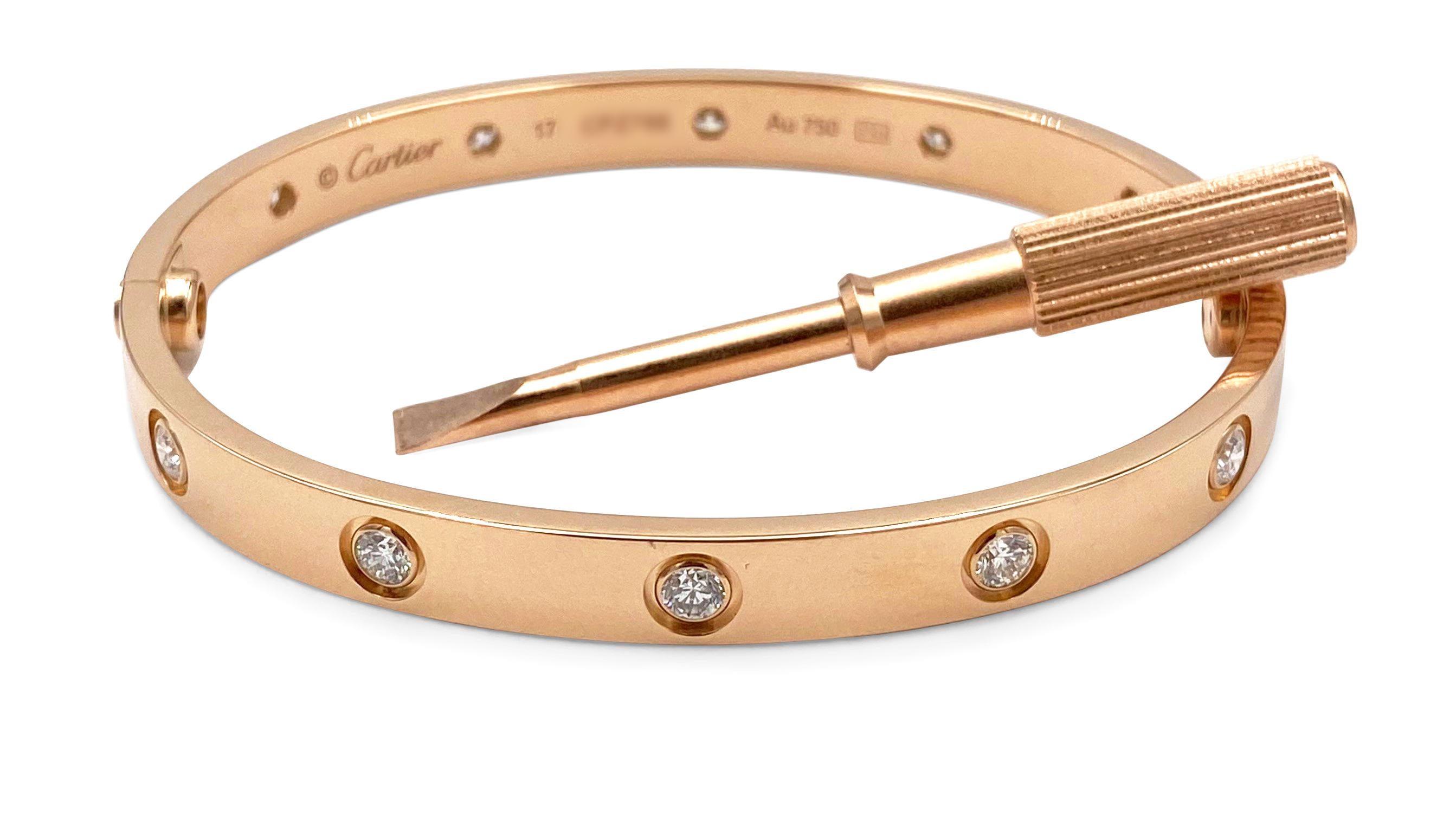 Authentic Cartier Love bangle in 18 karat rose gold set with ten round brilliant cut diamonds (E-F in color, VS clarity) weighing an estimated 0.96 carats total. Size 17. Signed Cartier, Au750. Love bangle comes with the orginal screwdriver, Cartier