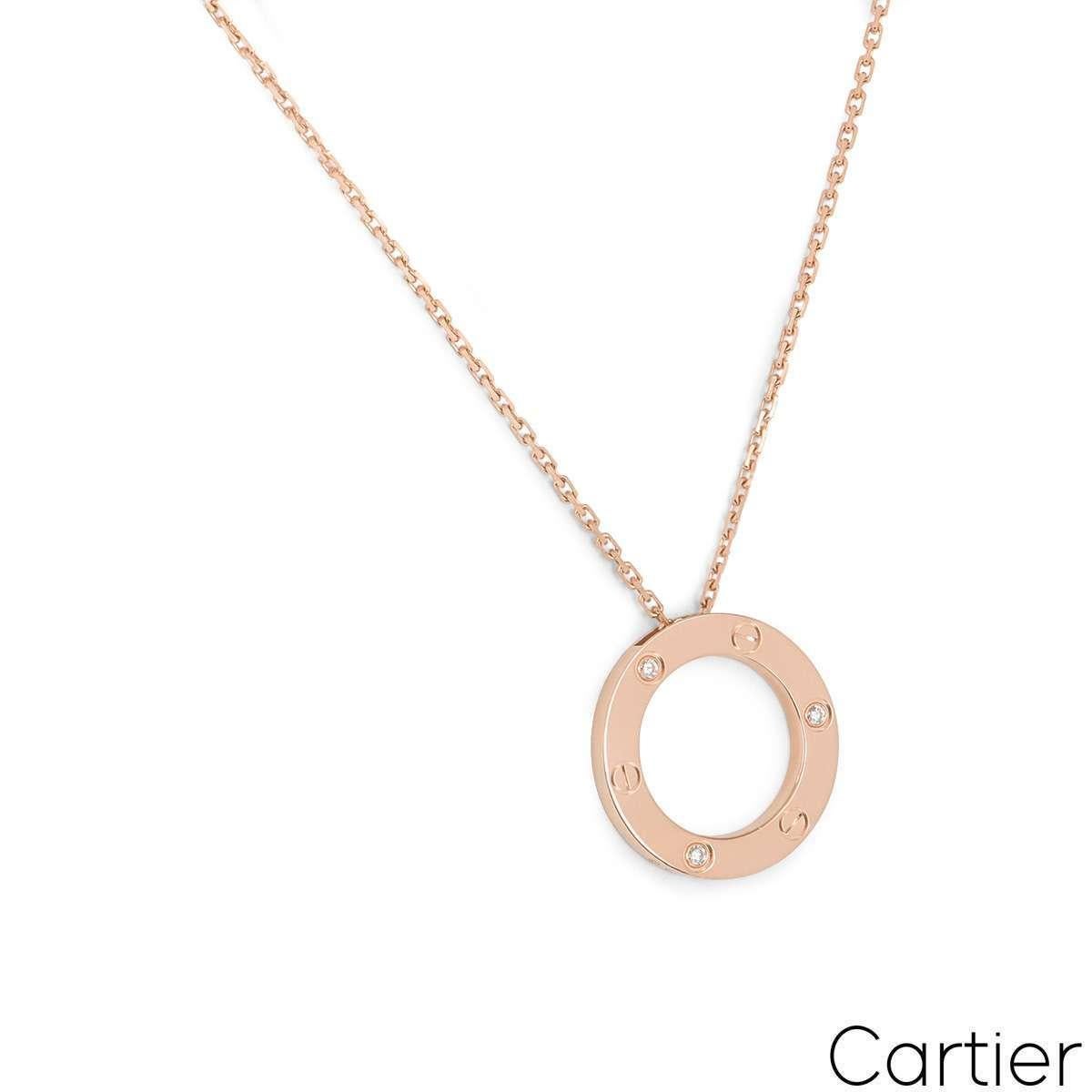 An 18k rose gold diamond pendant by Cartier from the Love collection. The pendant is comprises of an open circular motif, set with 3 round brilliant cut diamonds totalling 0.07ct and alternating between the iconic screws. On the reverse of the