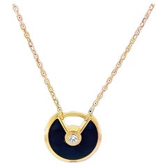Collana Amulette di Cartier in oro rosa e onice