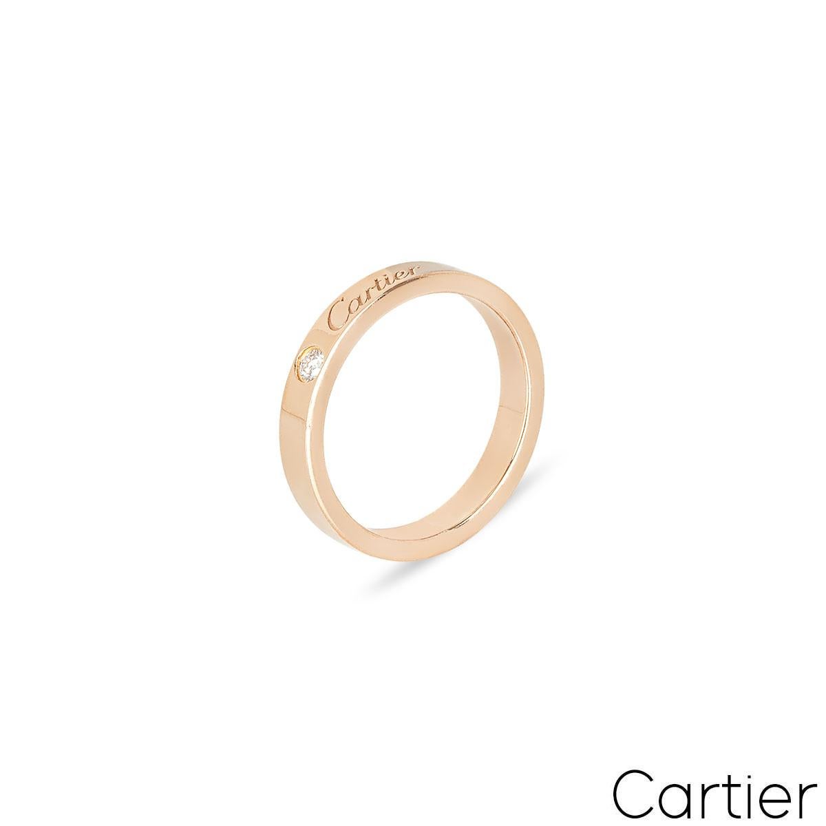 An 18k rose gold wedding band from the C de Cartier collection by Cartier. The ring features a single brilliant cut diamond 0.03ct, complemented by the Cartier signature. The wedding band is 3mm in width, a size UK K - EU 50 and has a gross weight