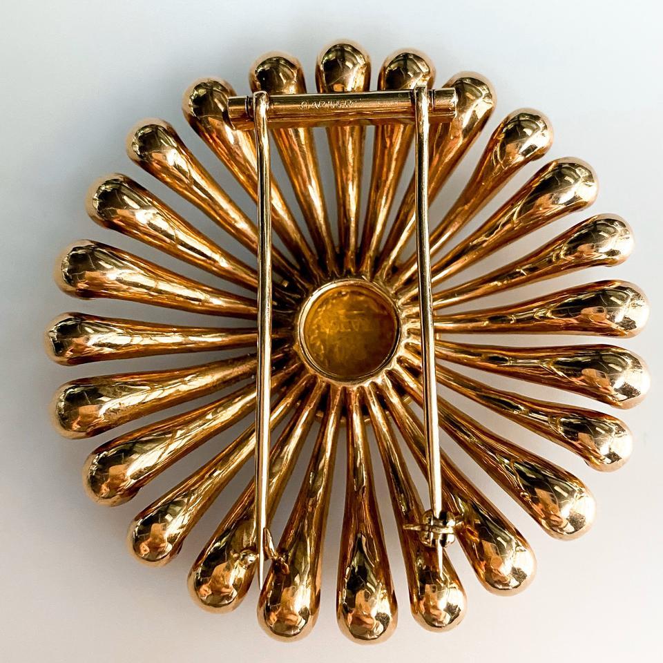 Their weight is not measured in carats and they do not shine - indeed, sometimes they are outright rusty. Yet ancient coins can add as much intrigue to jewelry as sparkling gems.

Presented here is a fabulous brooch centered with round coin crafted