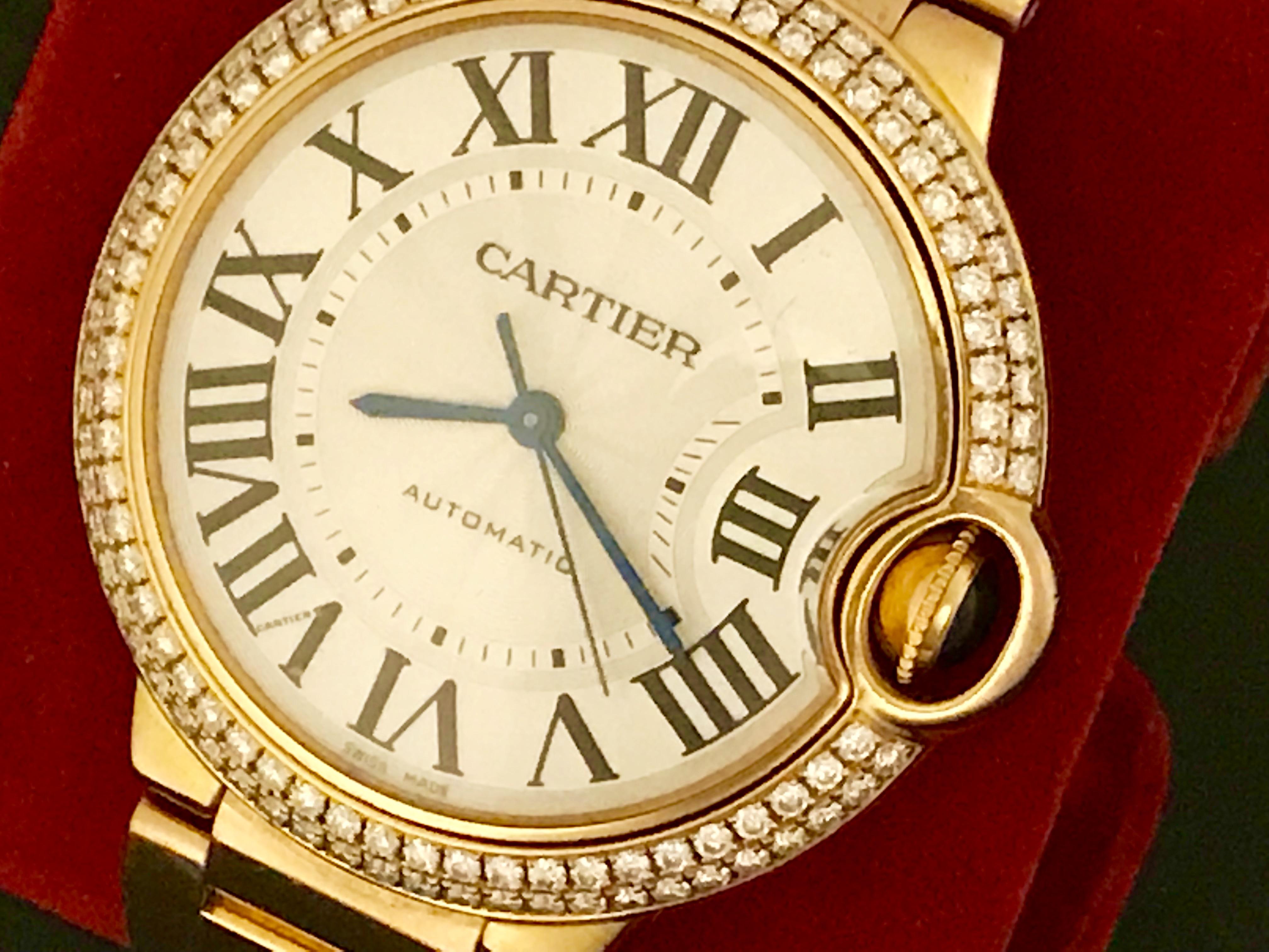 Cartier 18k Rose Gold Ballon Bleu Automatic Midsize Wrist Watch. Model WE900551. Silvered guilloche Dial with black Roman numerals, 18k Rose Gold round style case with two-row Cartier Diamond bezel (36mm dia.). Water Resistant to 30 Meters - 100
