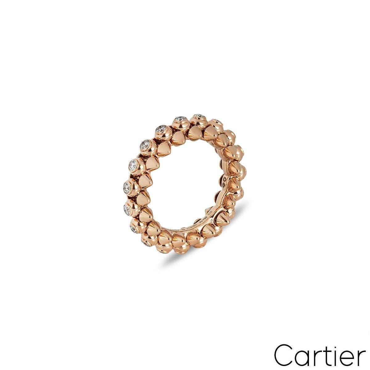 An 18k rose gold ring, from Cartier's Clash de Cartier collection. The rings design is composed of the centre being set throughout with 18 brilliant-cut diamonds totalling 0.53ct which are complemented by a stud design on either side. Weighing 10.51