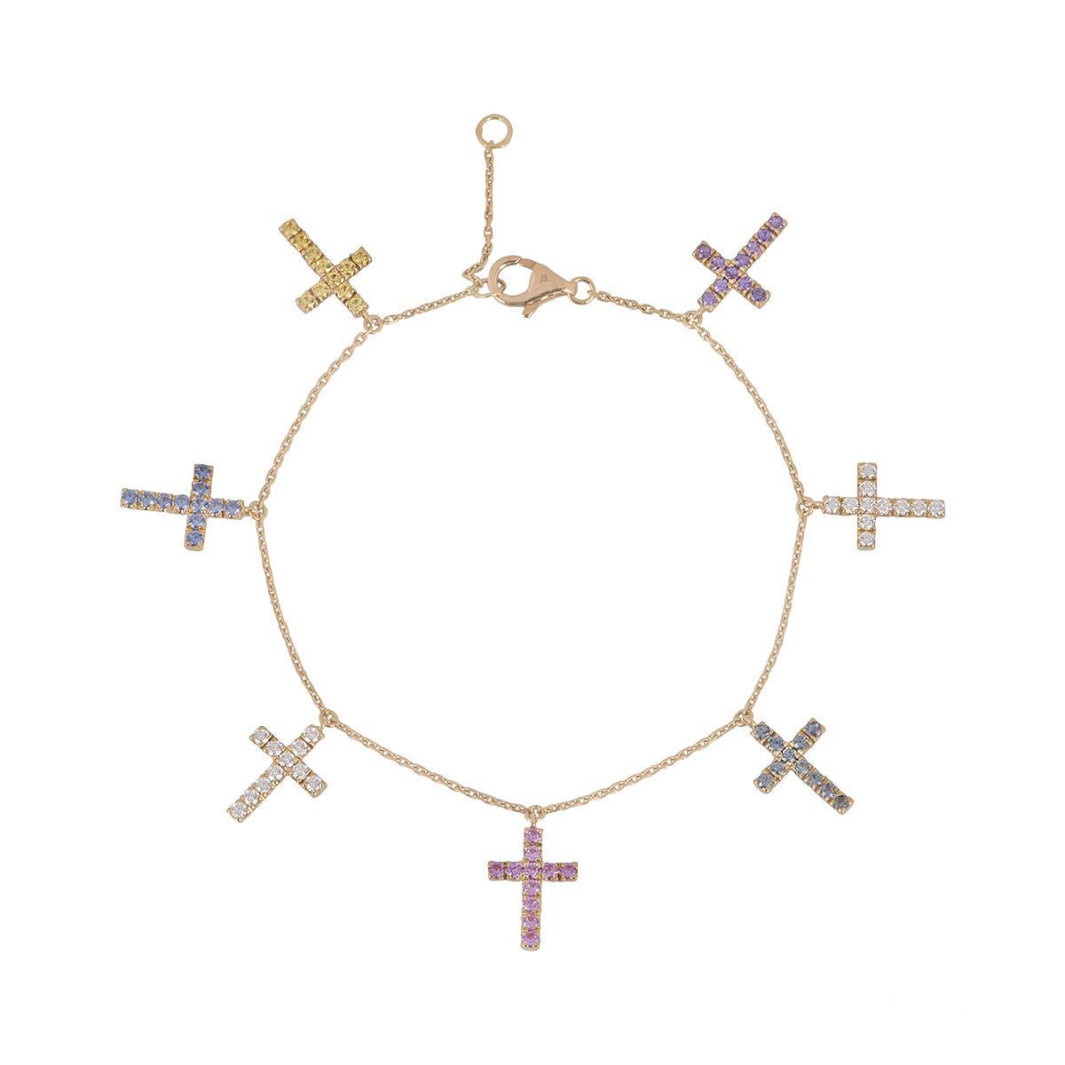 An elegant 18k rose gold bracelet by Cartier. Featuring seven cross motifs adorned with diamonds and a array of sapphires in pink, yellow, blue, purple, and green hues. The piece is set with 22 round brilliant-cut diamonds totalling approximately